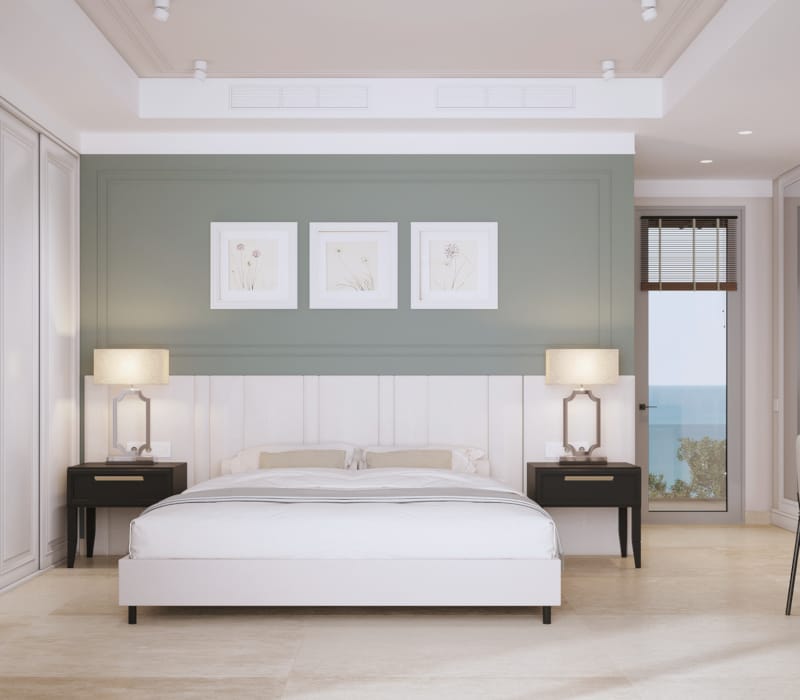 a bedroom with a bed and lamps