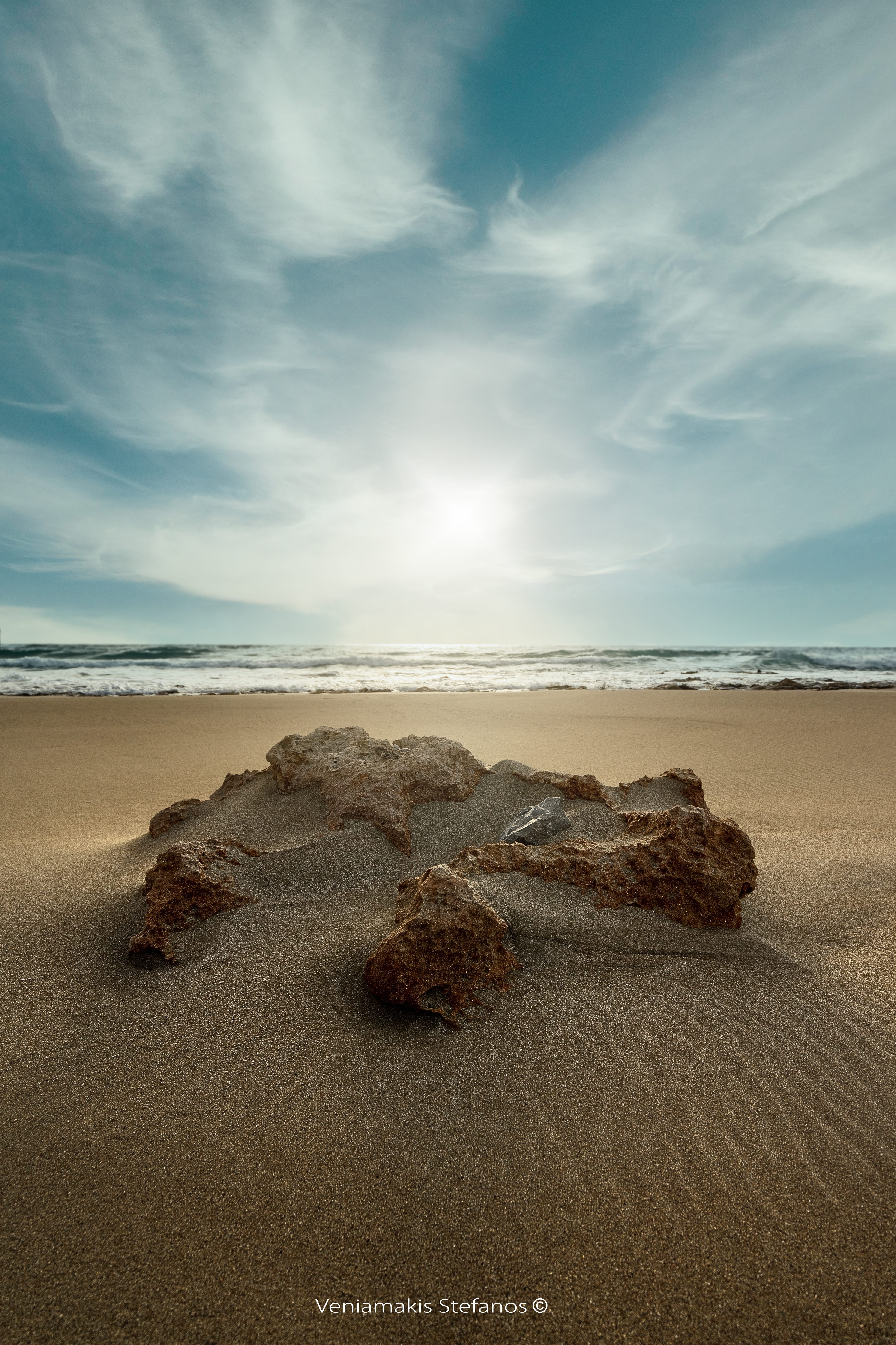 a beach with sand and water