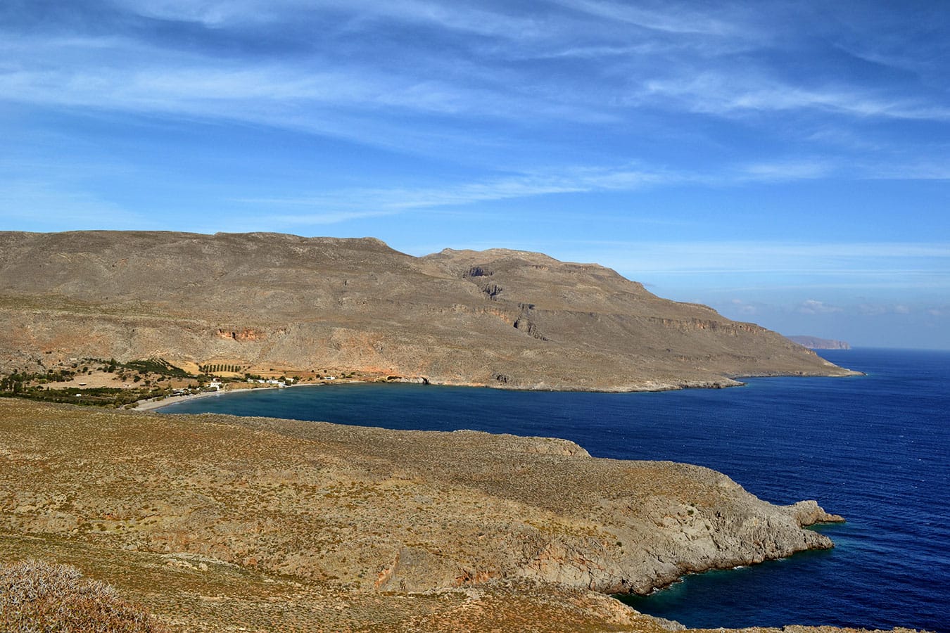 a body of water with land in the back