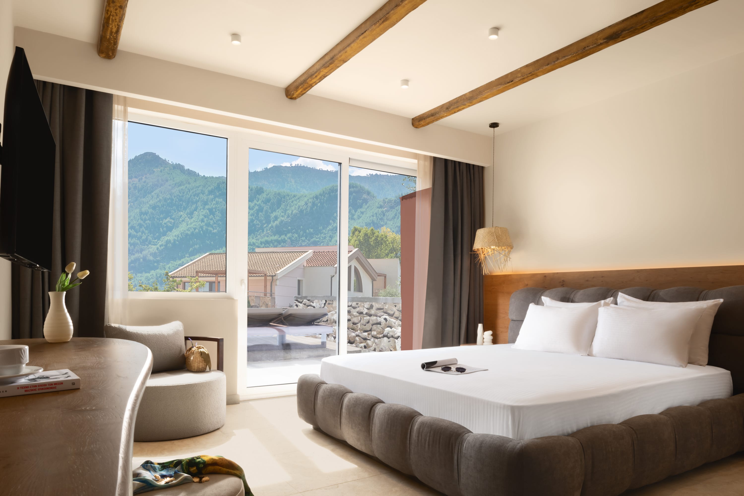 a bedroom with a large window