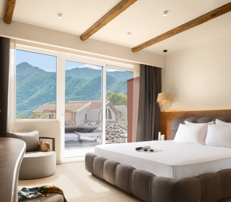 a bedroom with a large window