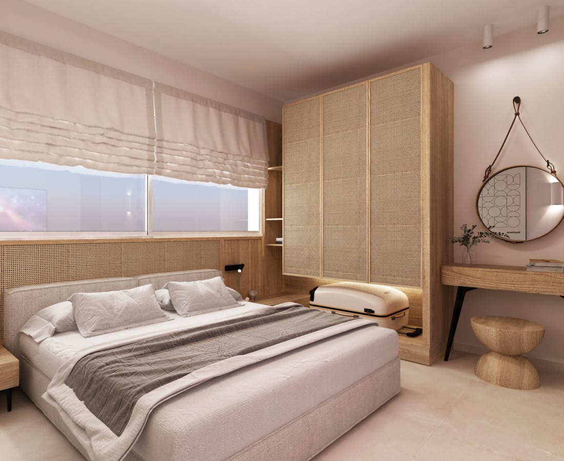 a bedroom with a bed and a mirror