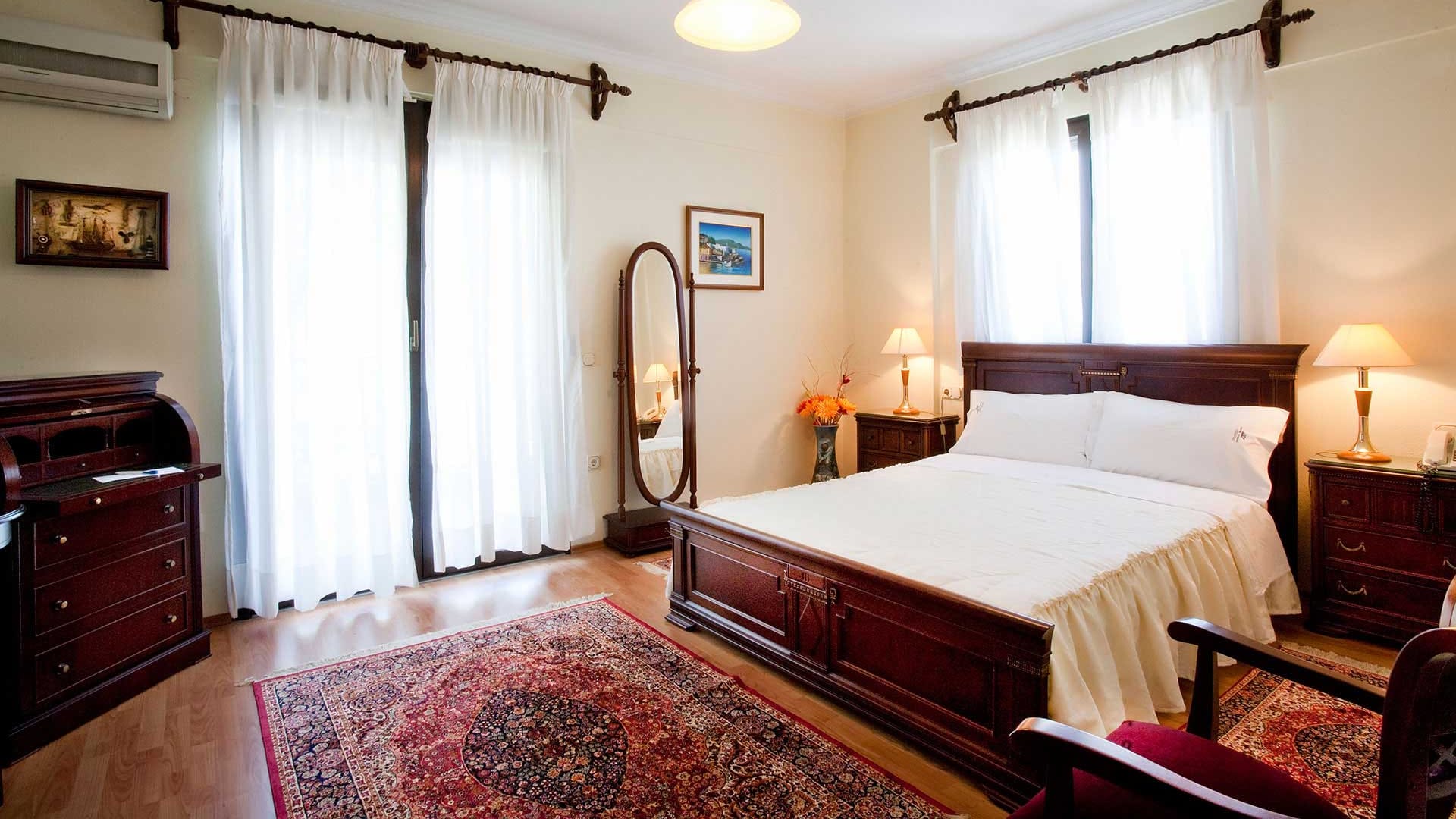 a bedroom with a bed and a mirror