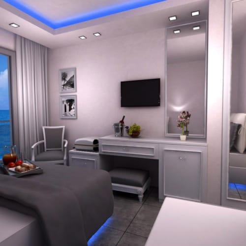 a room with a bed and a tv