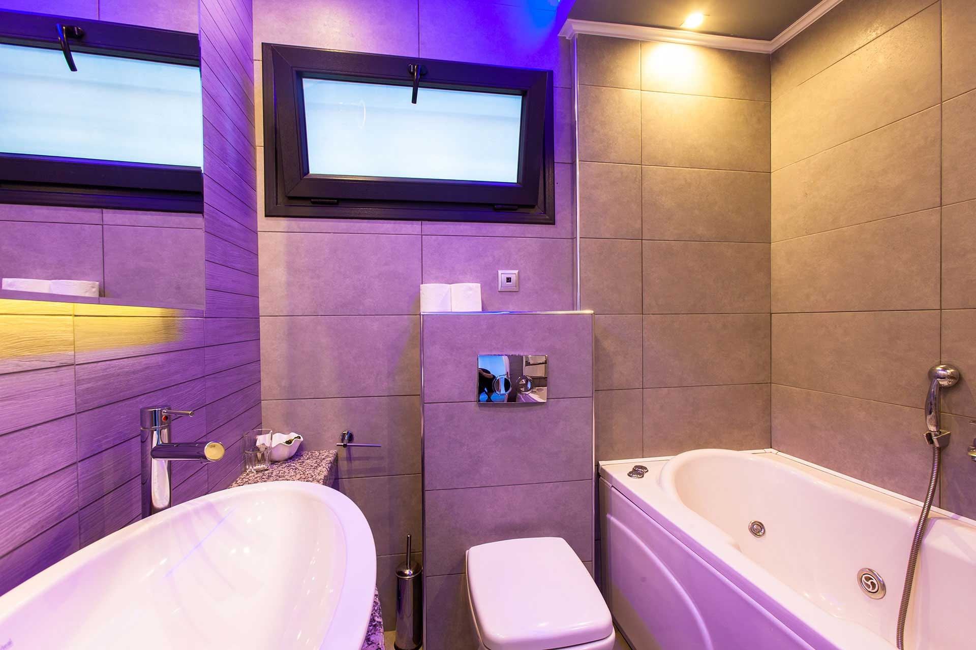 a bathroom with a tub and toilet