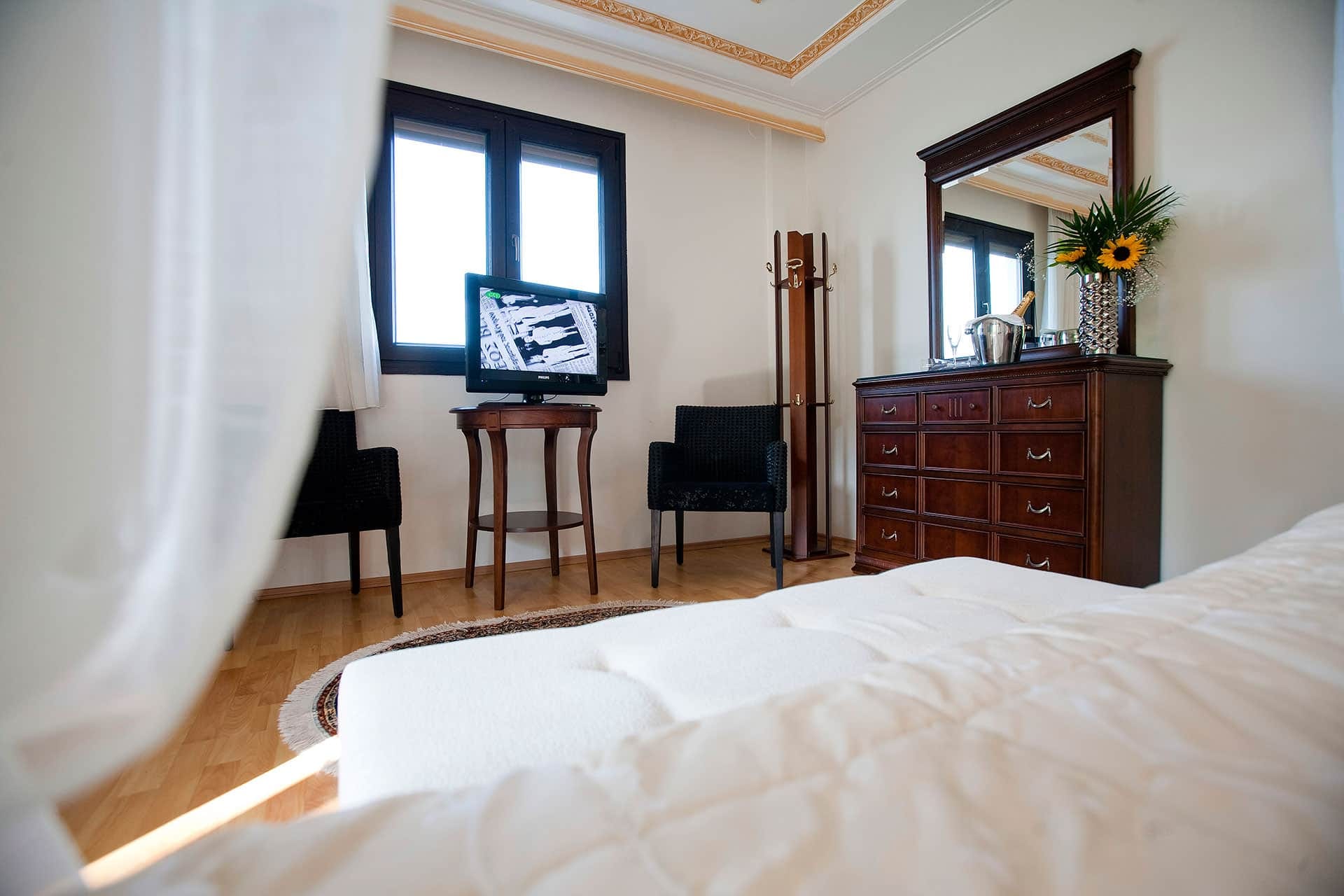 a bedroom with a bed and a desk