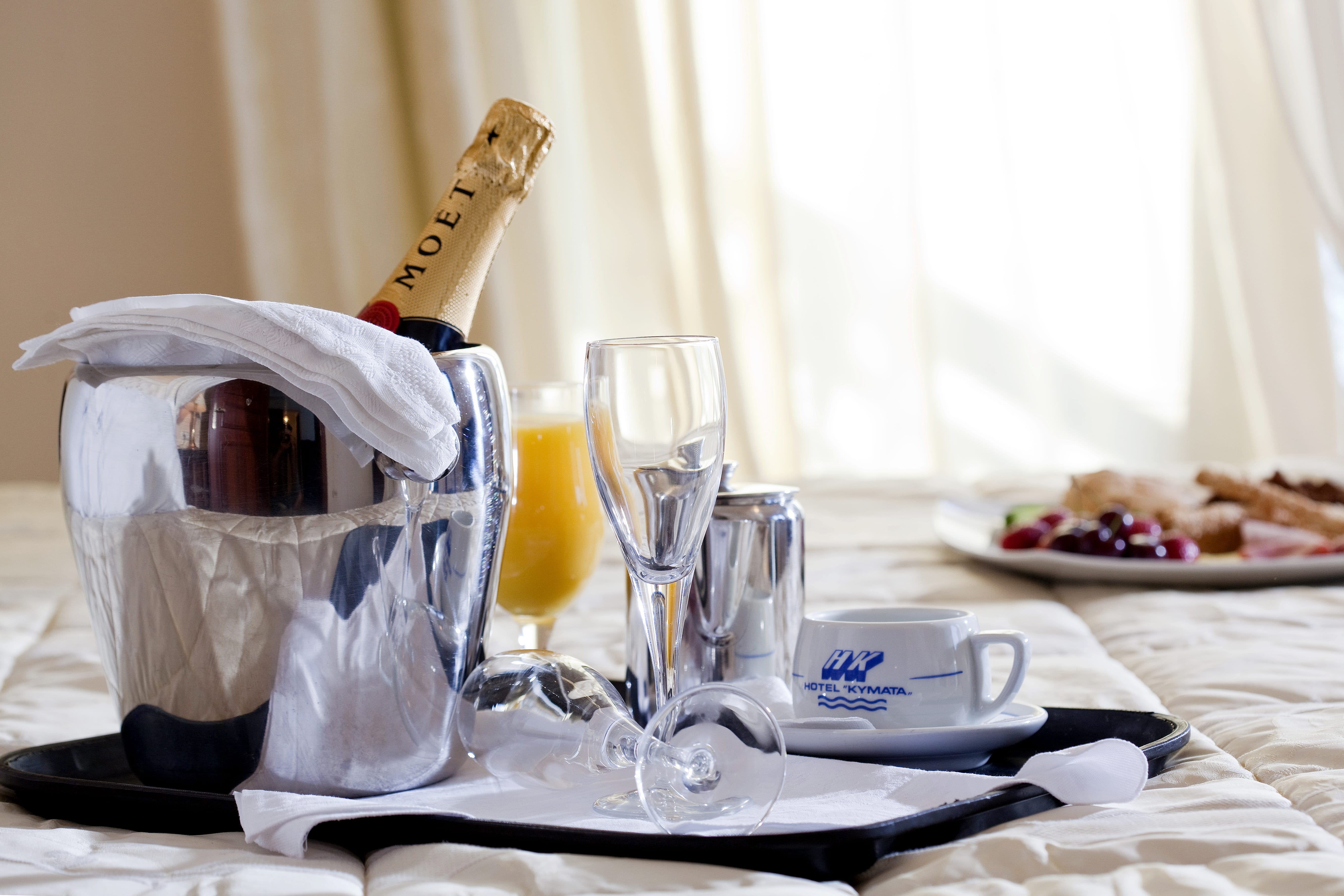 a glass of wine and a bottle of wine on a table