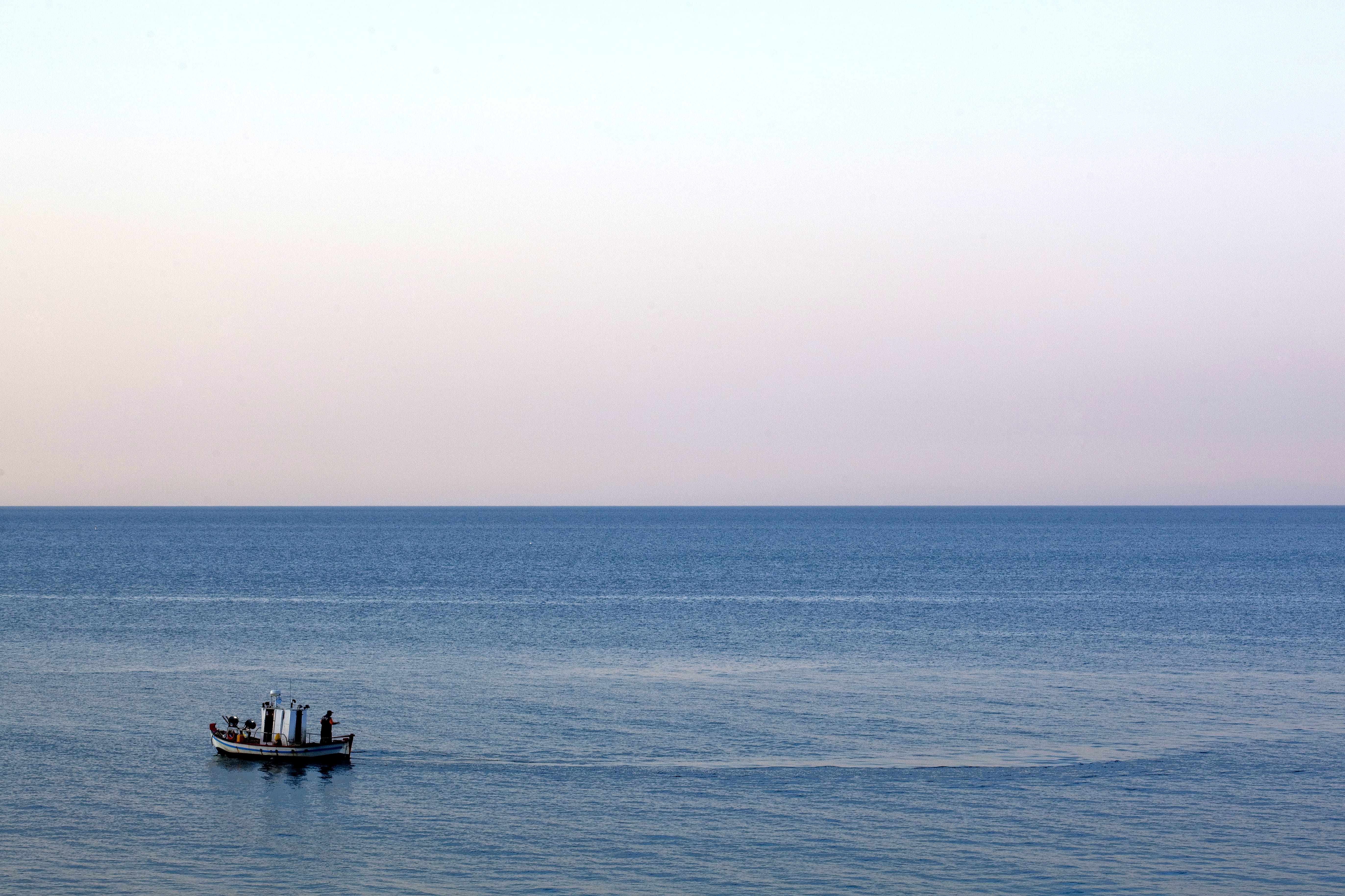 a boat sailing on the sea