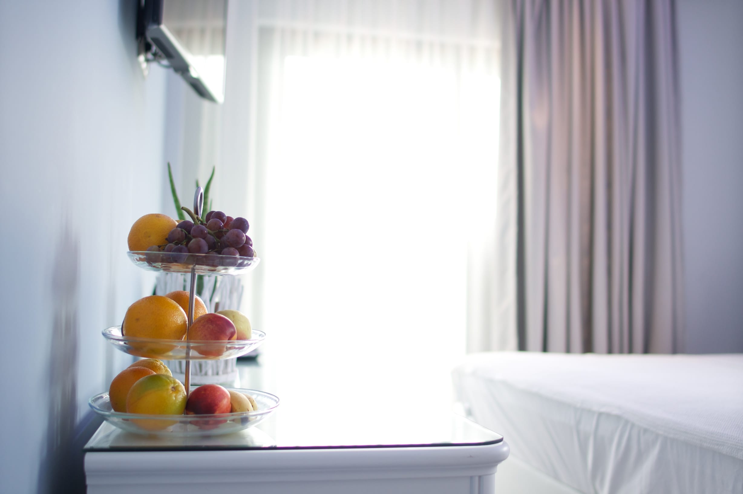 a window with a bowl of fruit