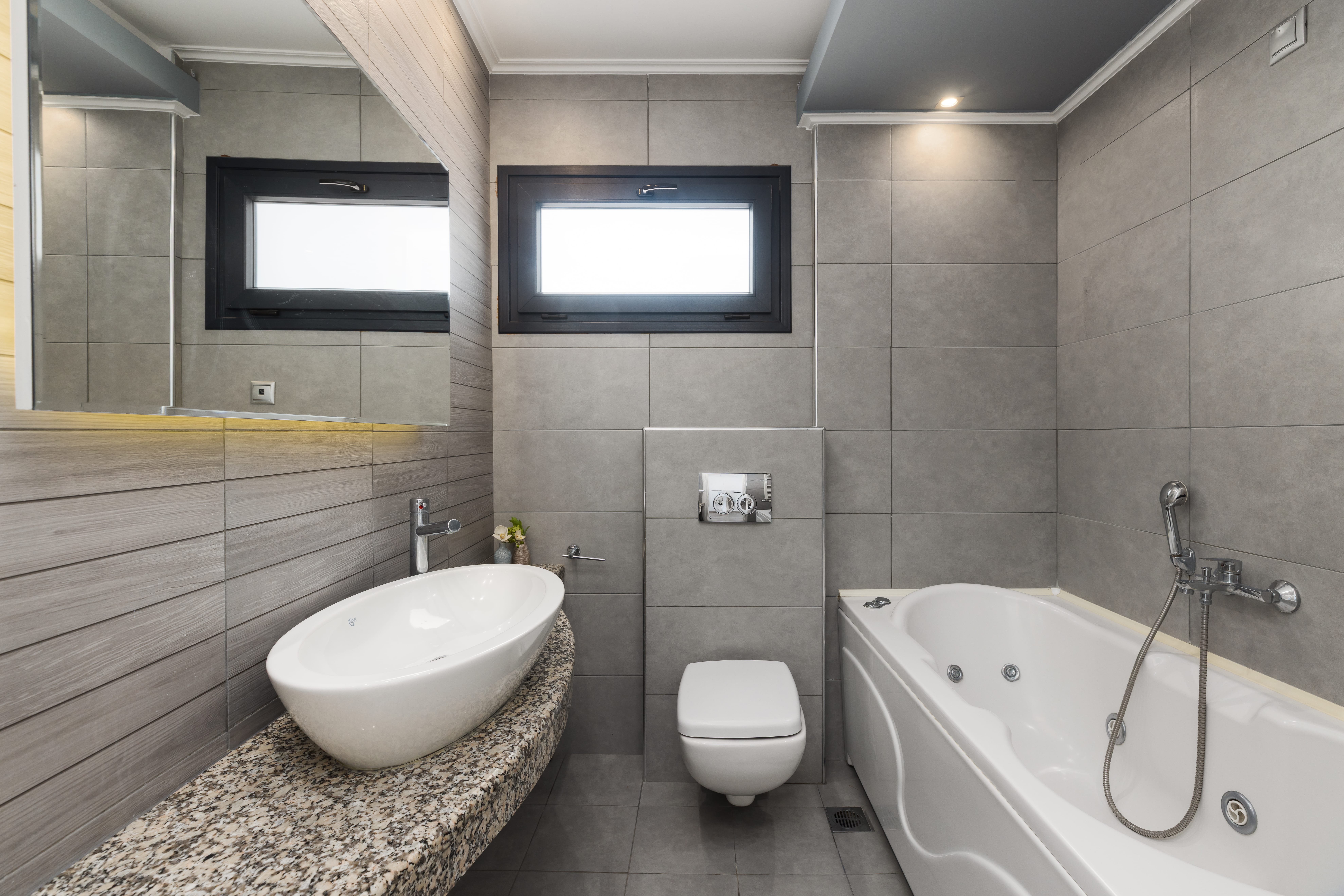 a bathroom with a tub sink and toilet