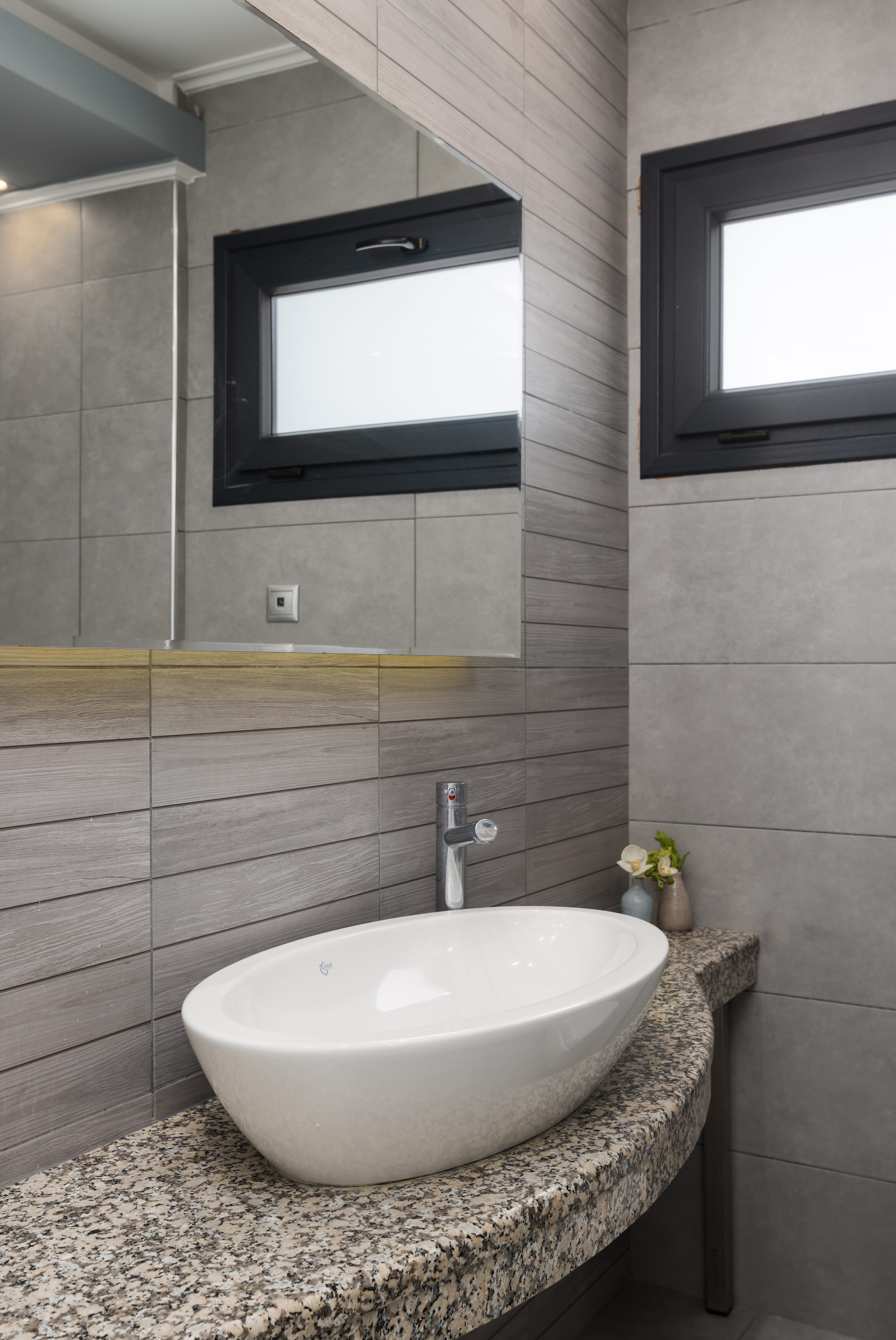 a bathroom with a marble countertop