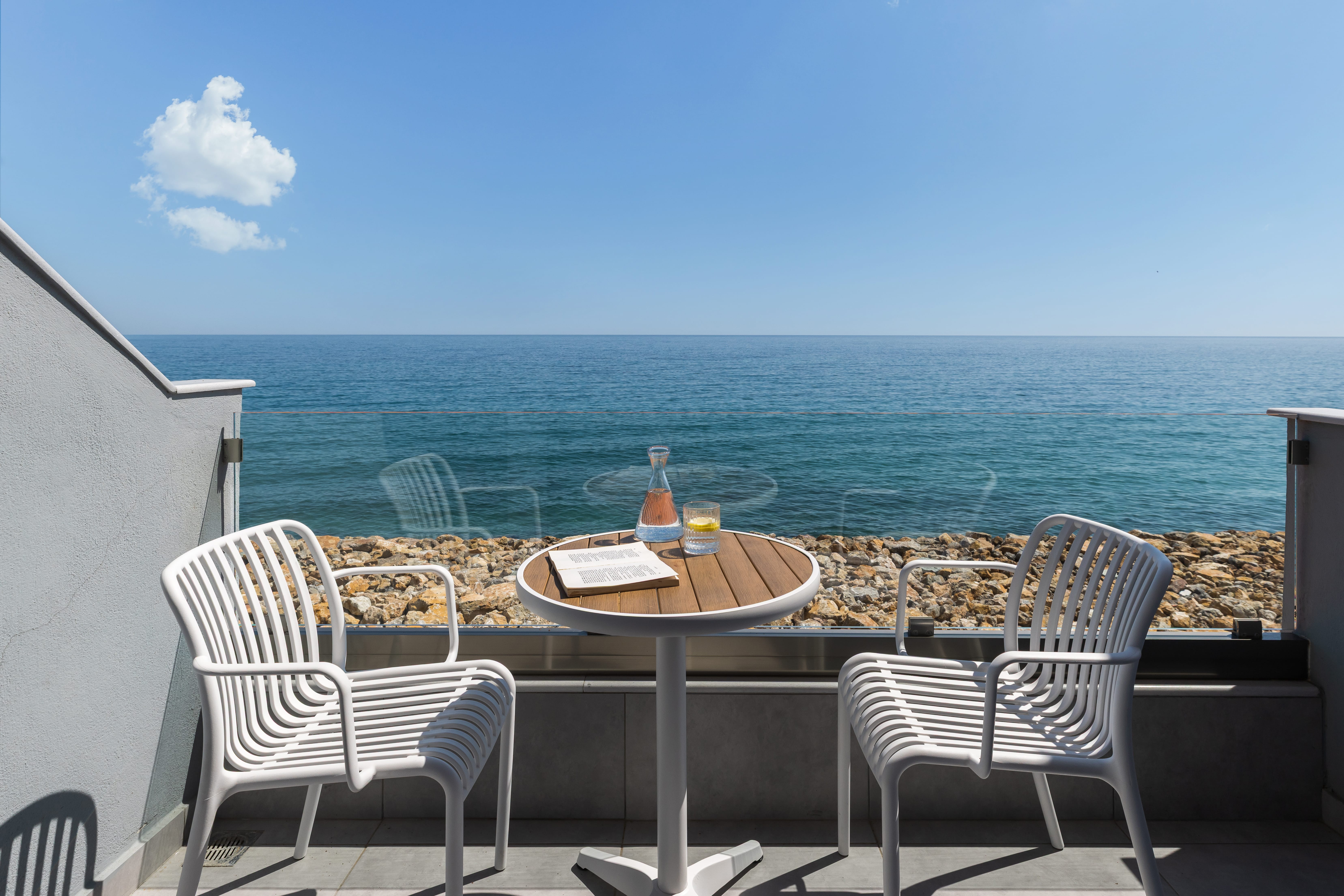 a table and chairs on a deck