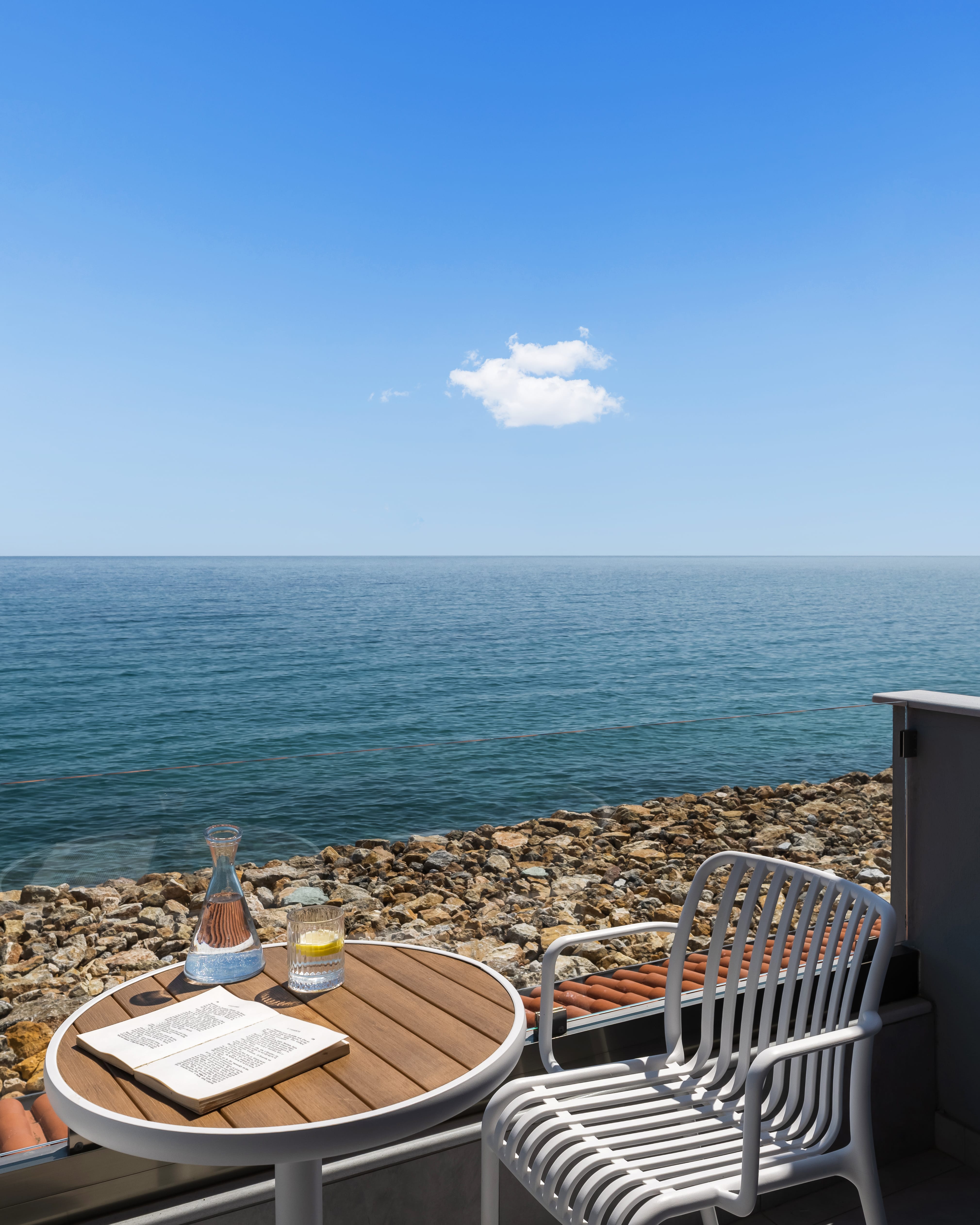 a table and chairs on a beach