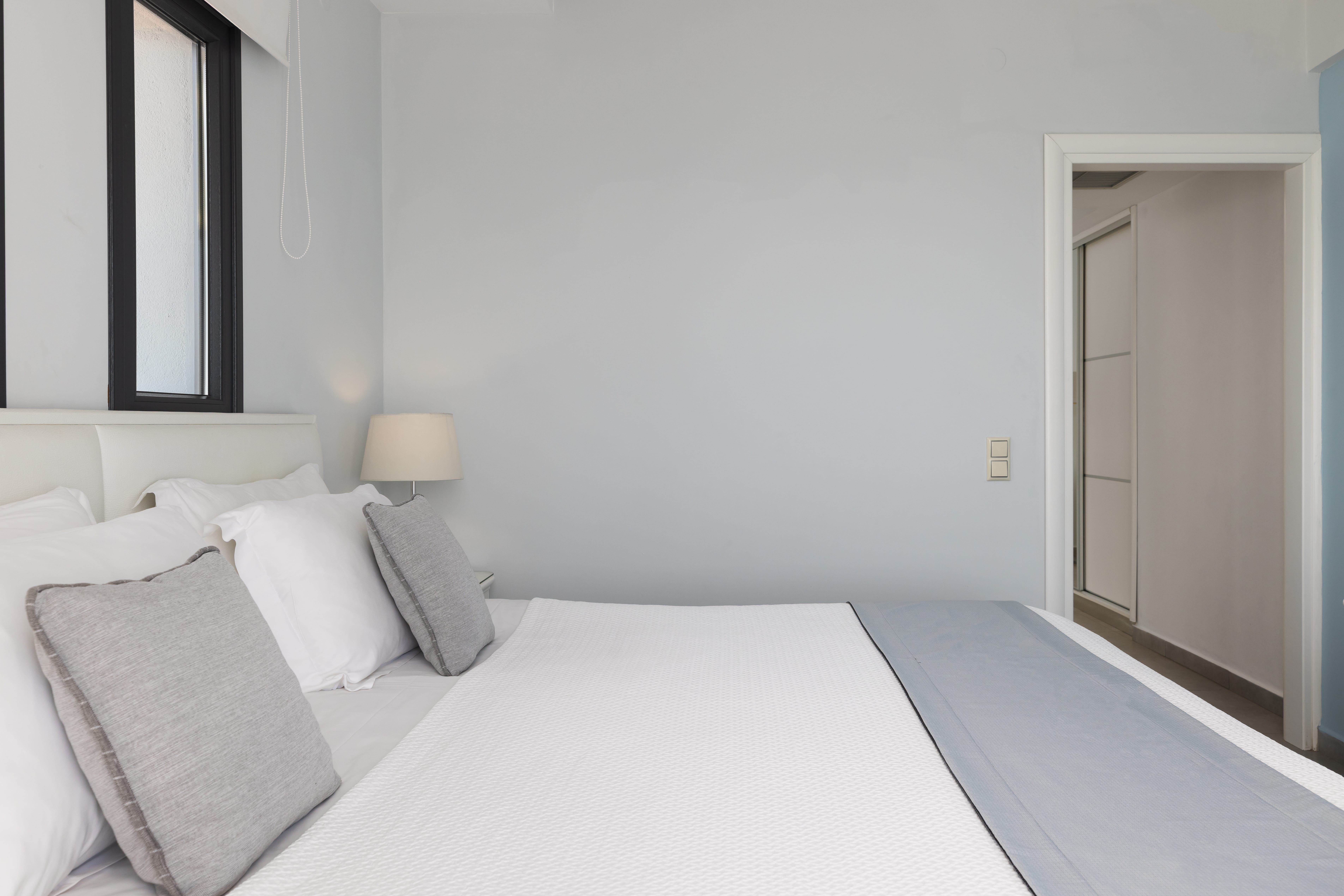 a bed with white sheets