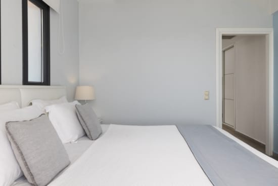 a bed with white pillows