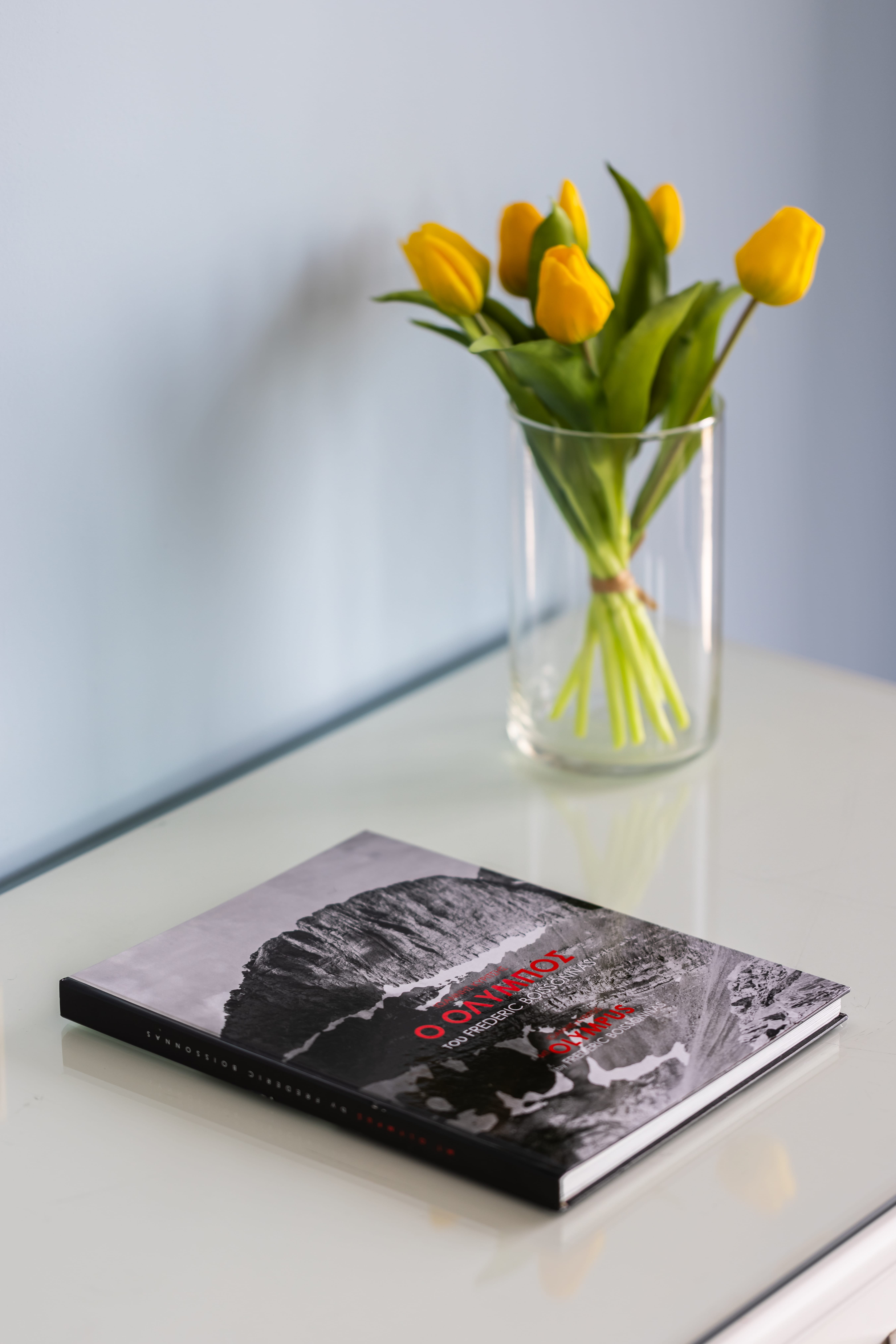 a vase with yellow flowers