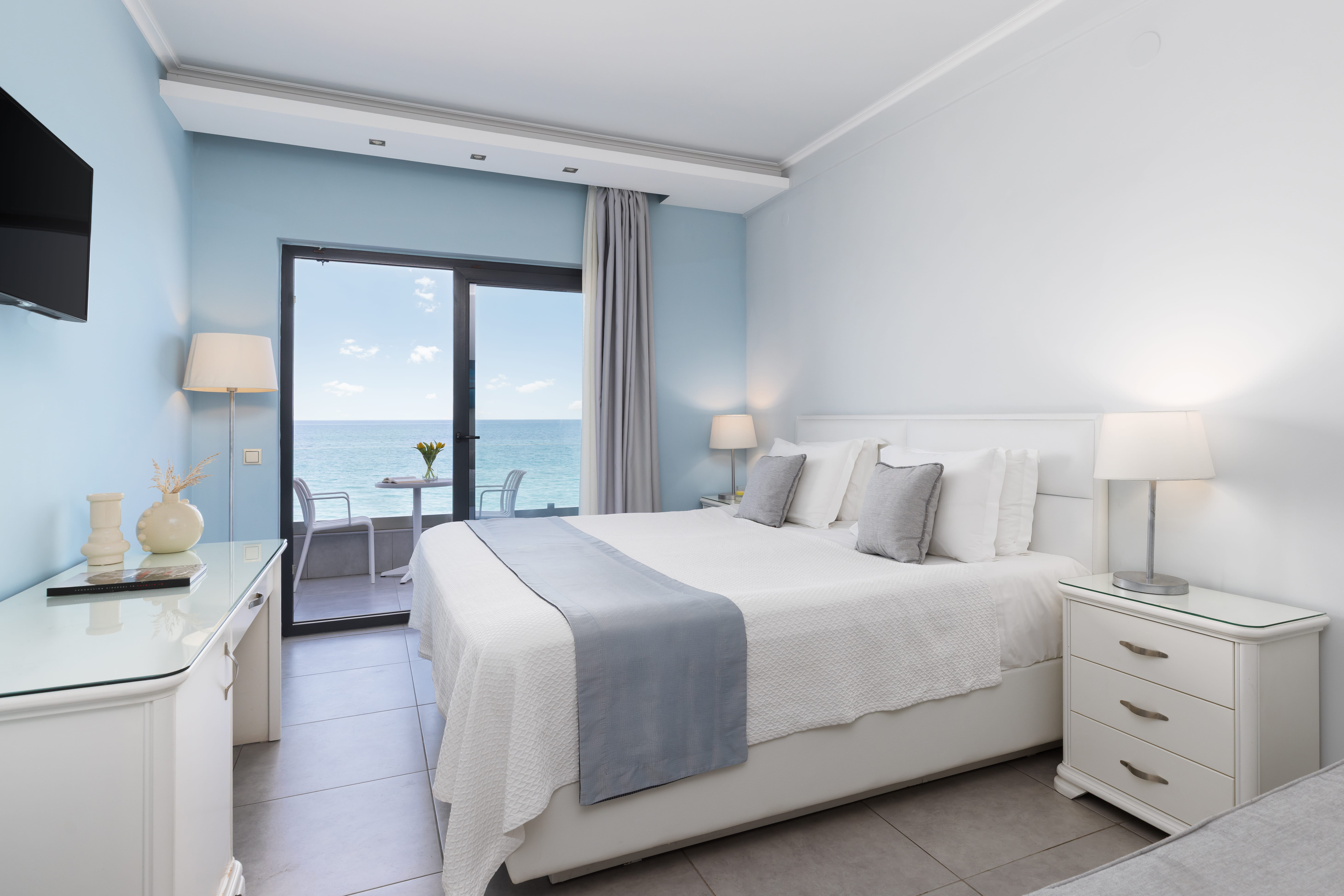 a bedroom with a large window