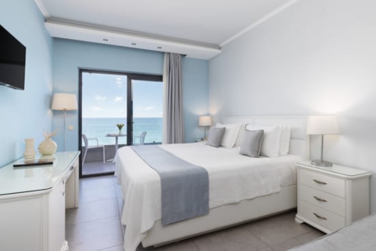 a bedroom with a large window