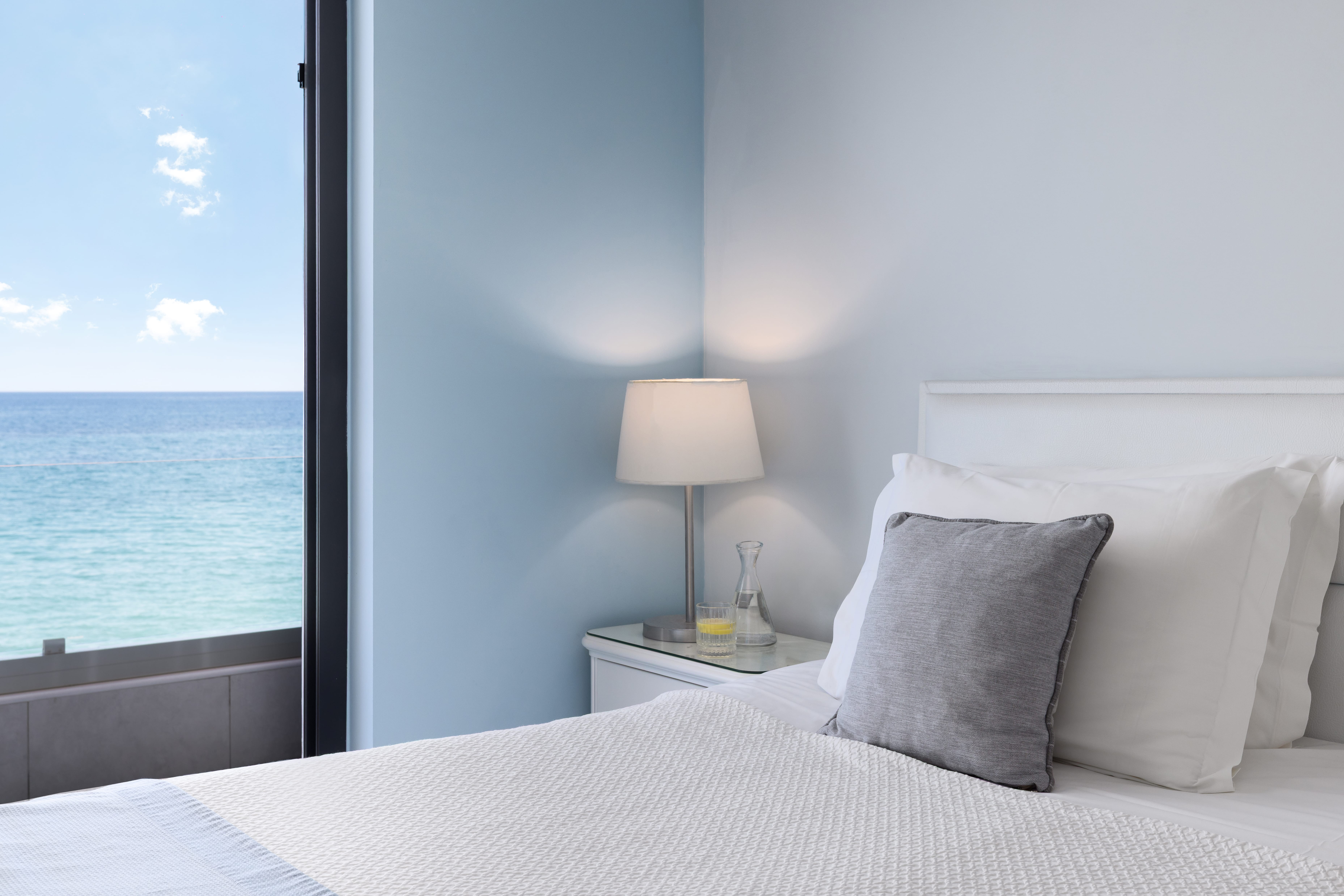 a bed with a lamp on it