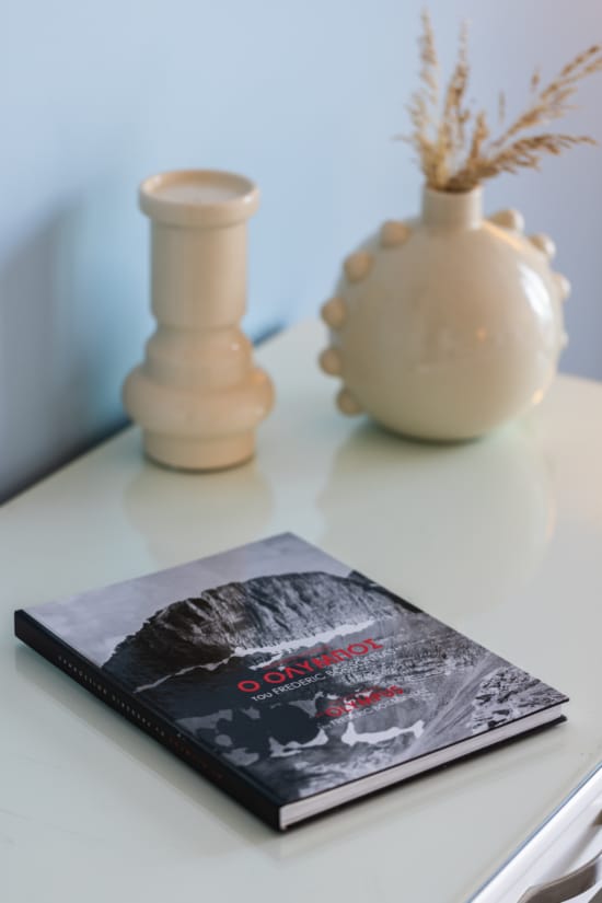 a book and a vase on a table