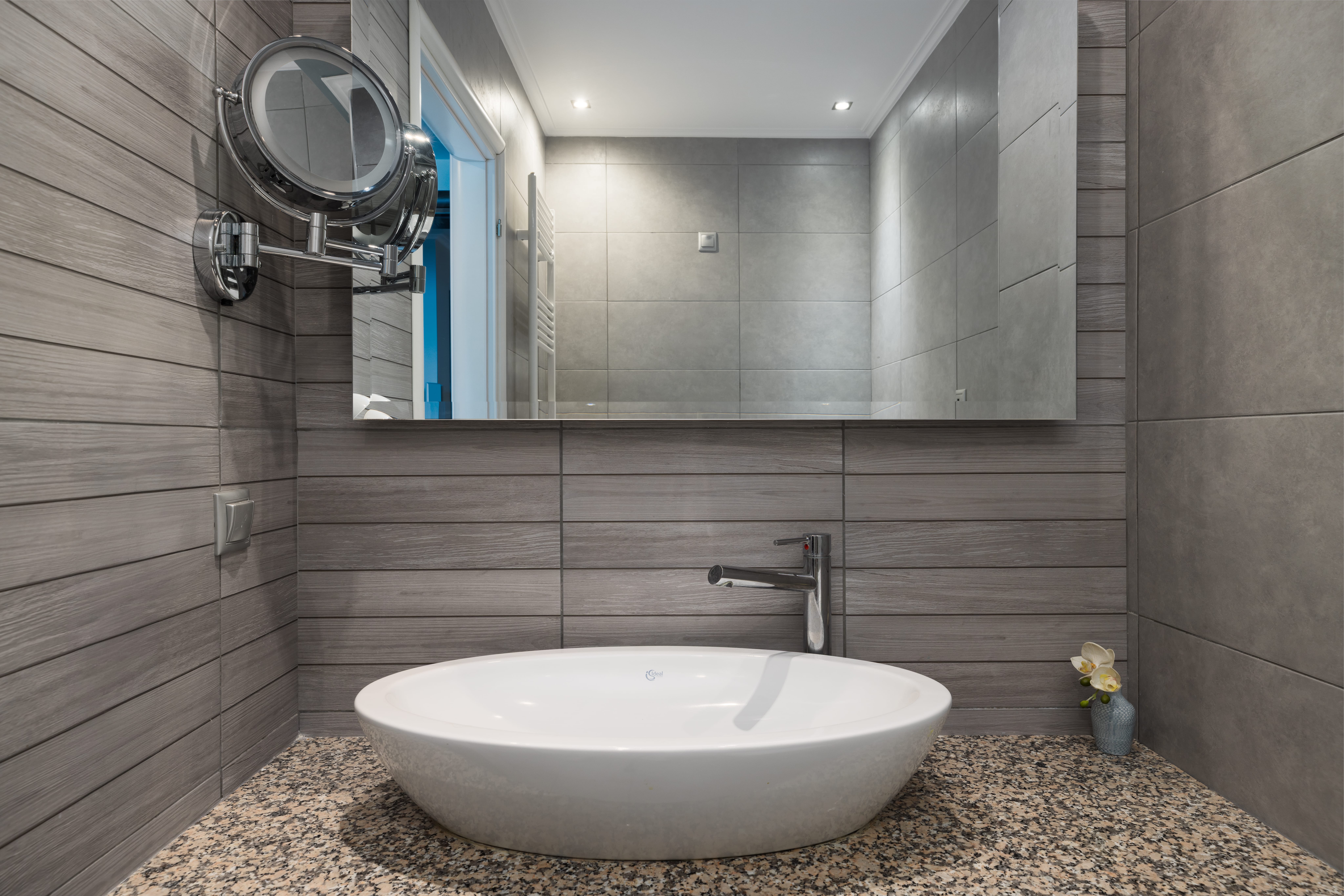 a bathroom with a large mirror