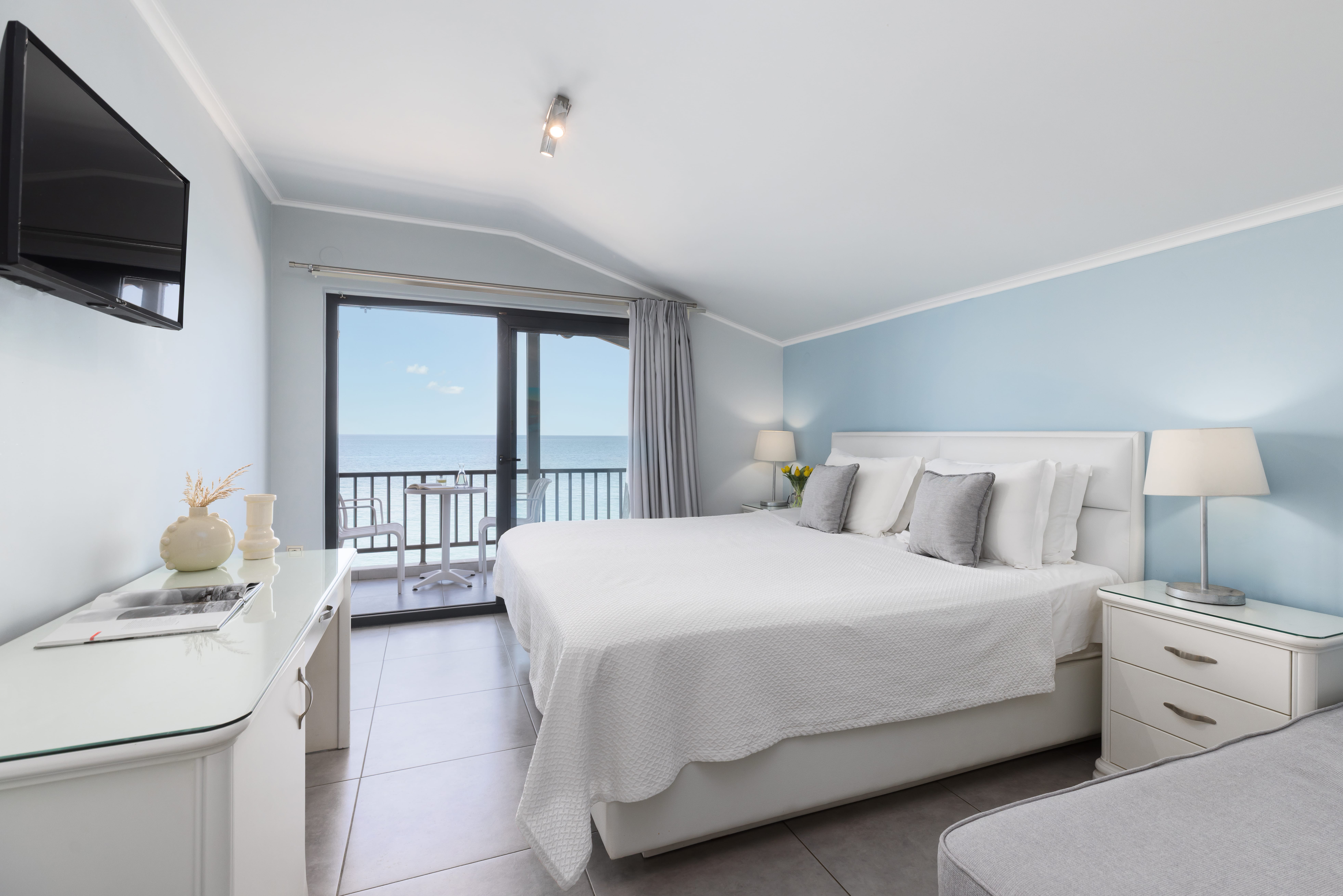 a bedroom with a large window