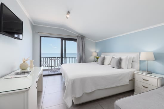 a bedroom with a large window