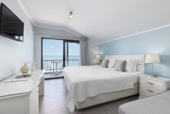 a bedroom with a large window