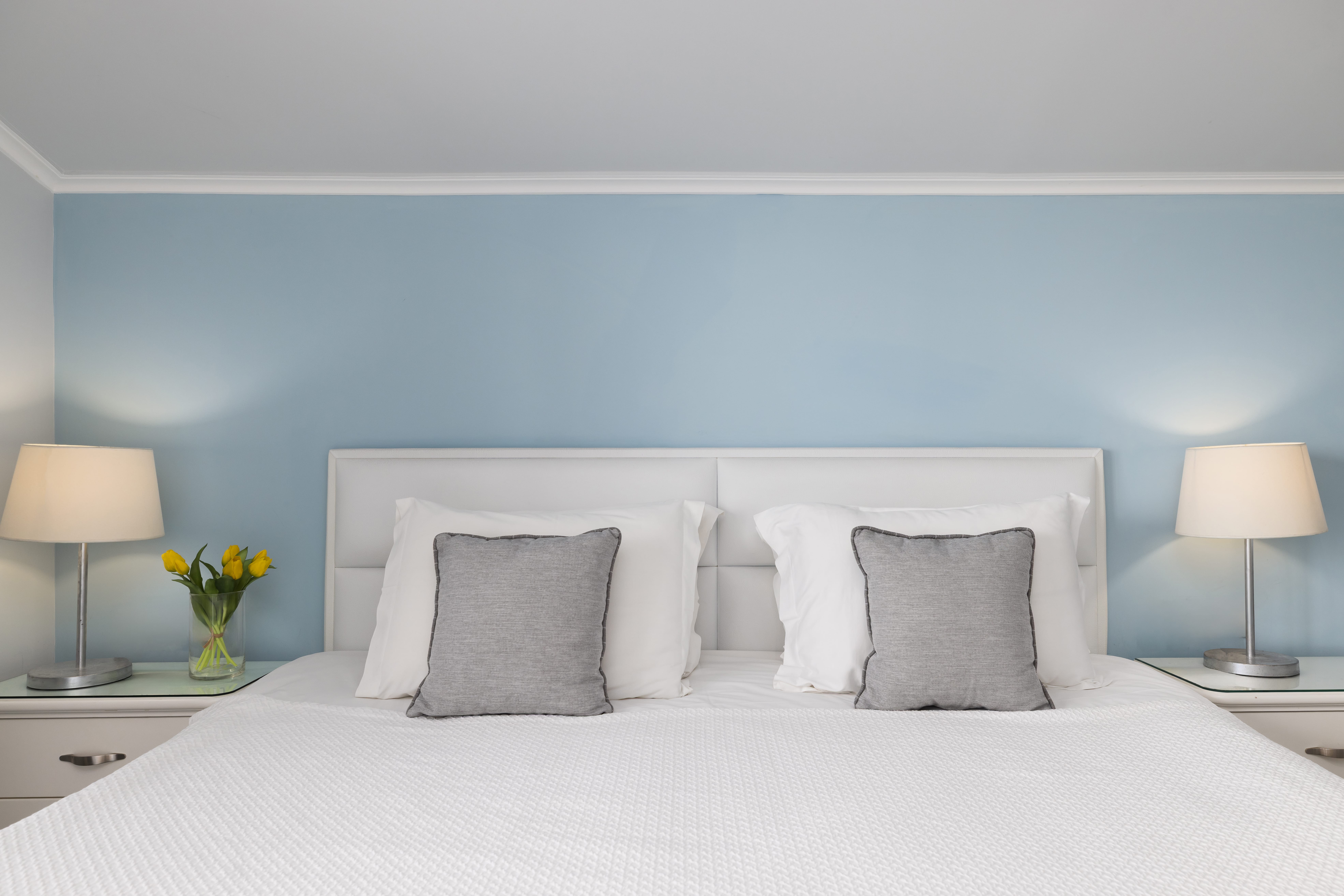 a bed with white sheets