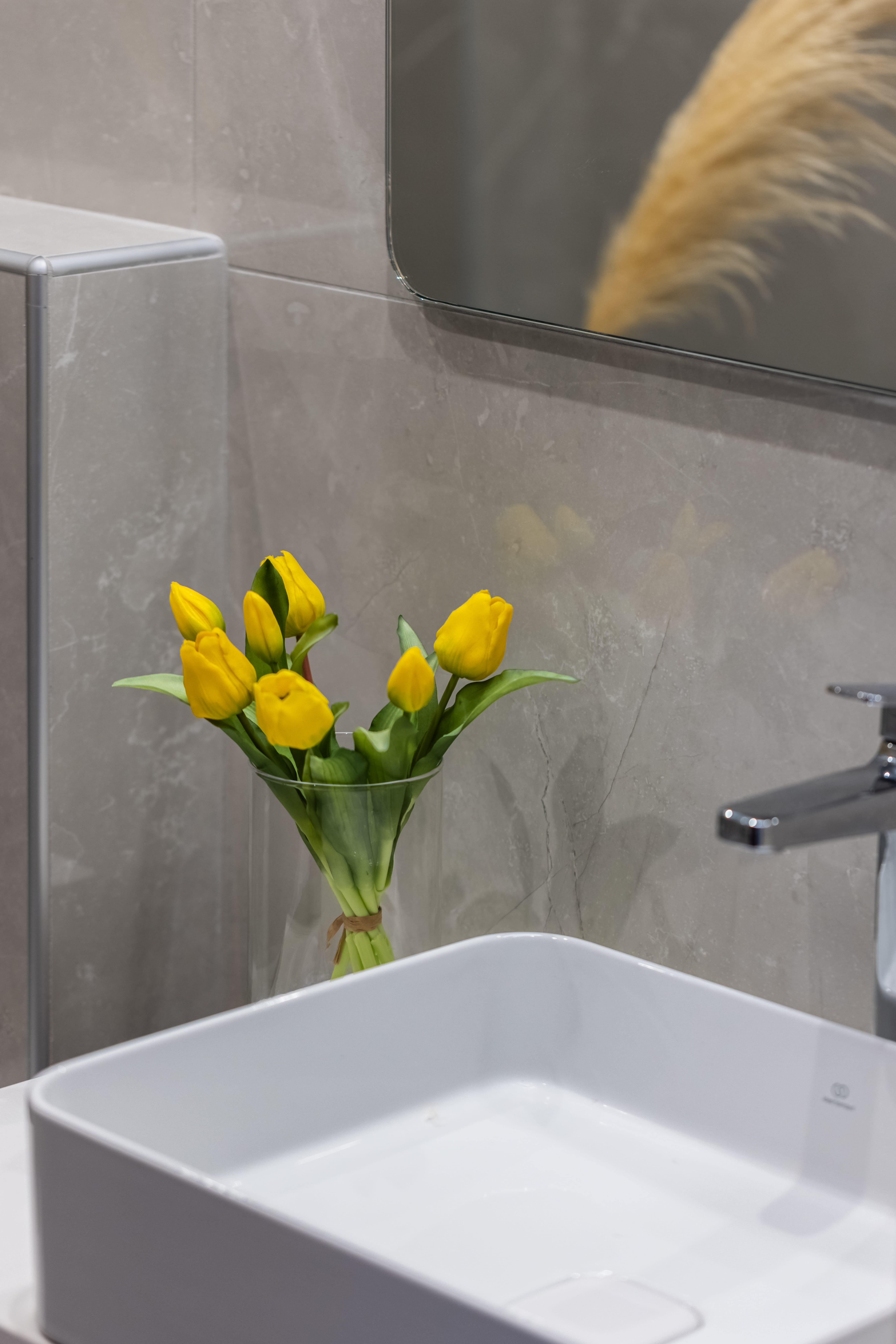 a vase with yellow flowers