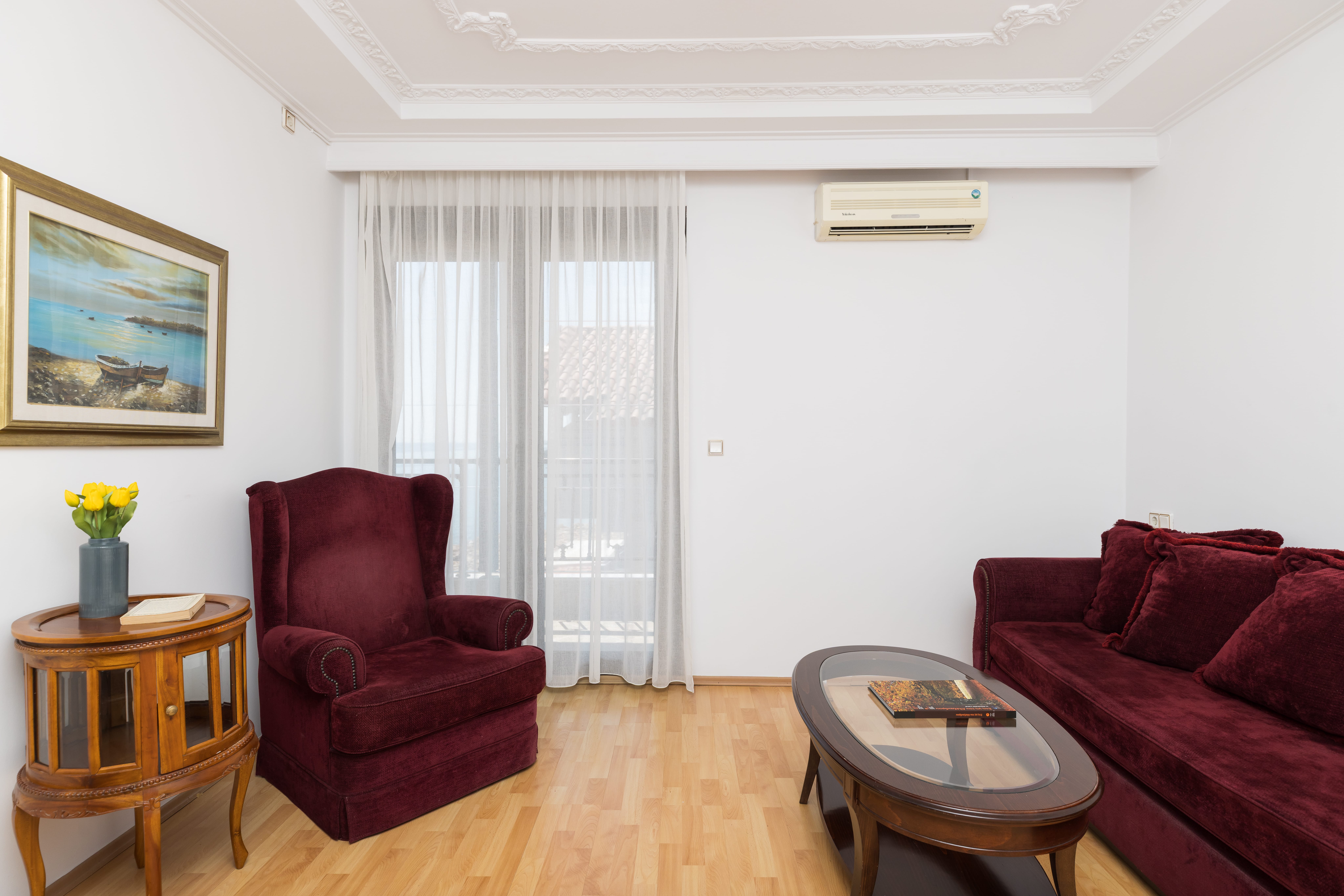 a living room with a red couch