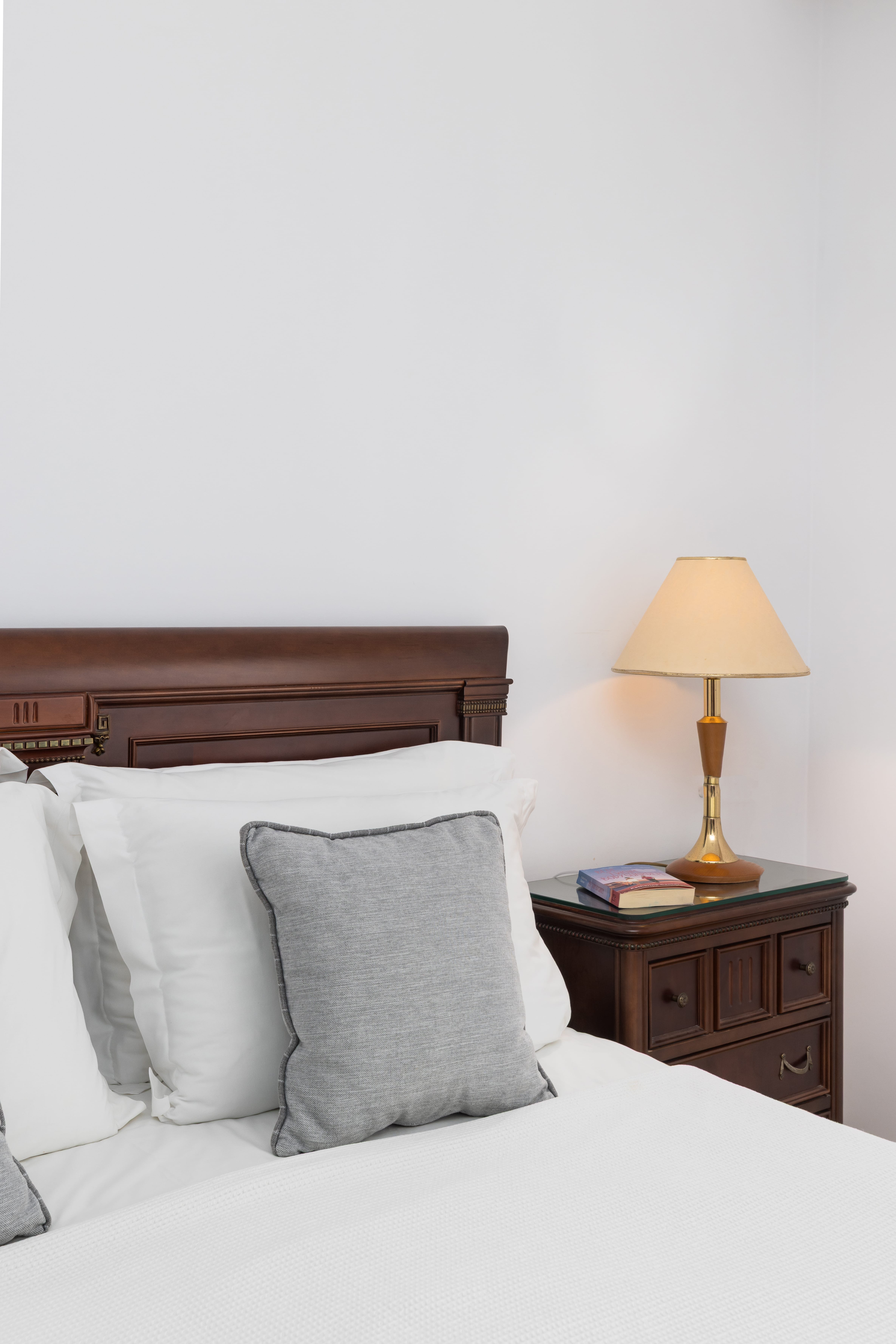 a bed with a lamp on it