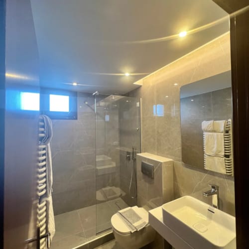 a bathroom with a glass shower