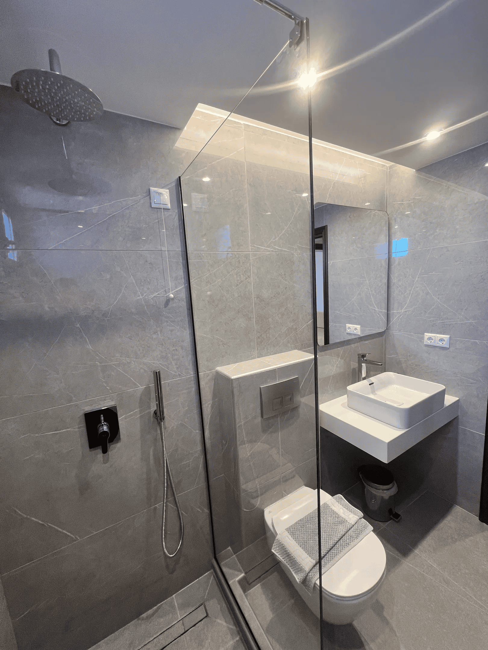 a bathroom with a glass shower