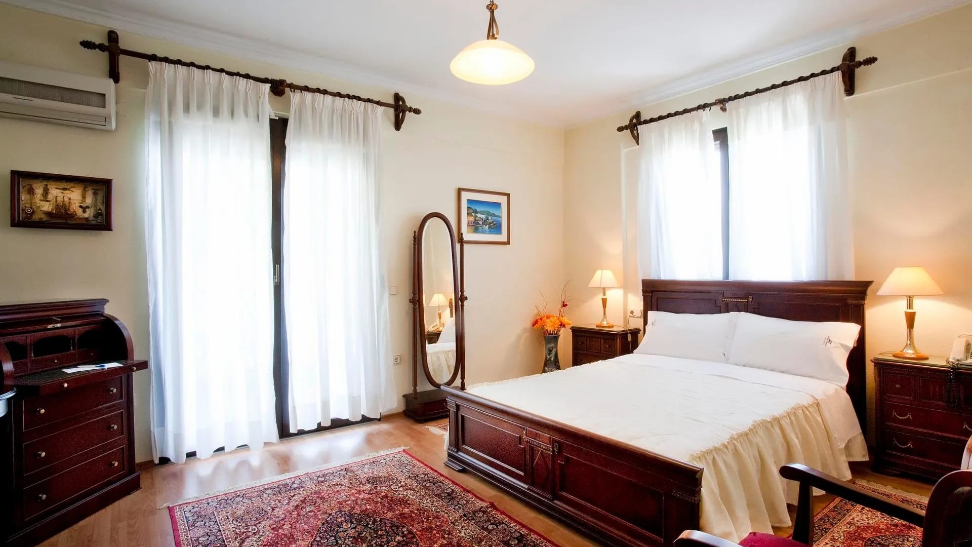 a bedroom with a bed and a mirror
