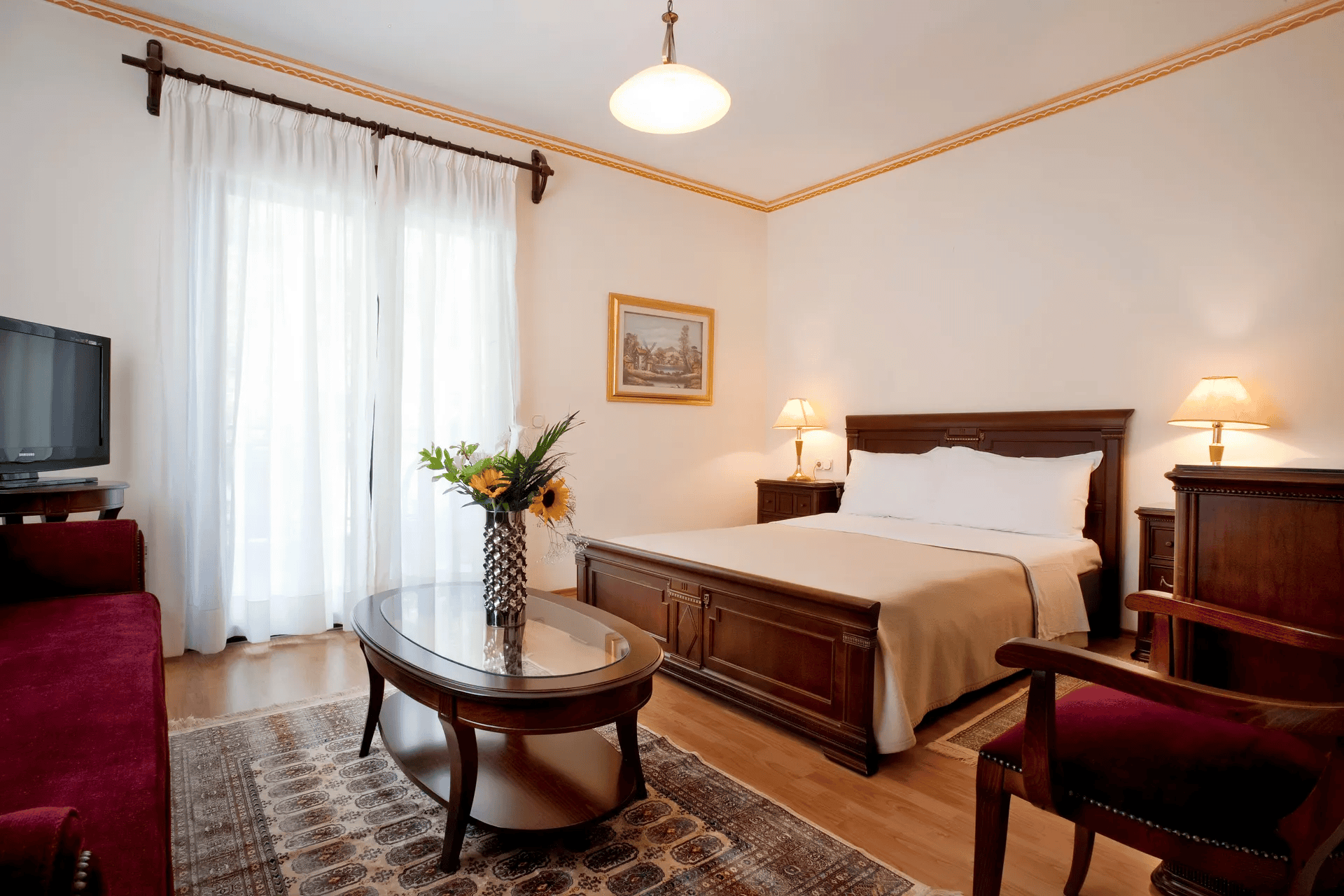 a bedroom with a bed and a table