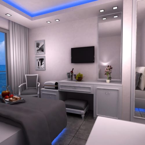 a room with a bed and a tv
