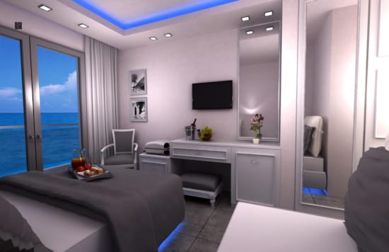 a room with a bed and a tv