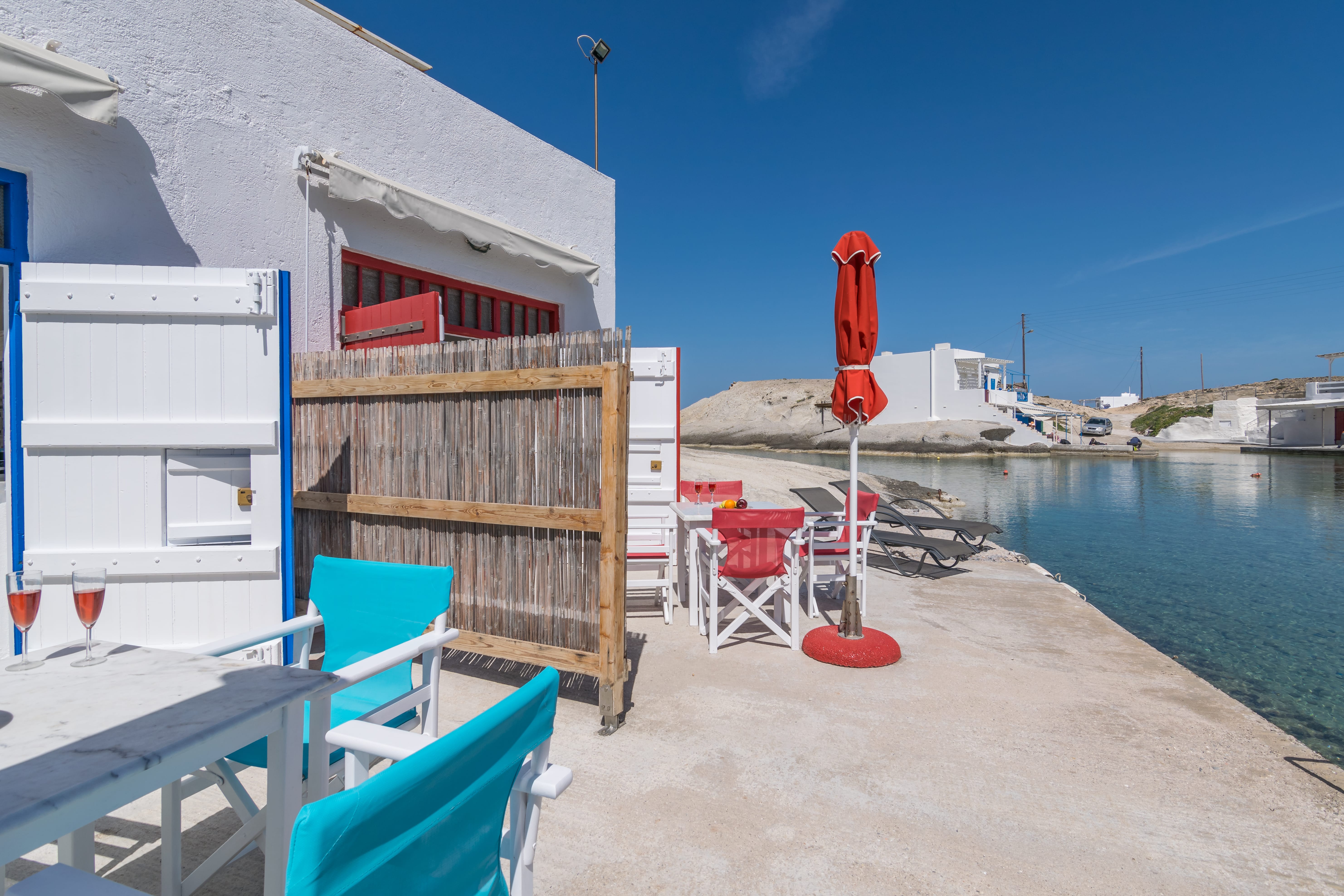 a row of buildings next to a body of water