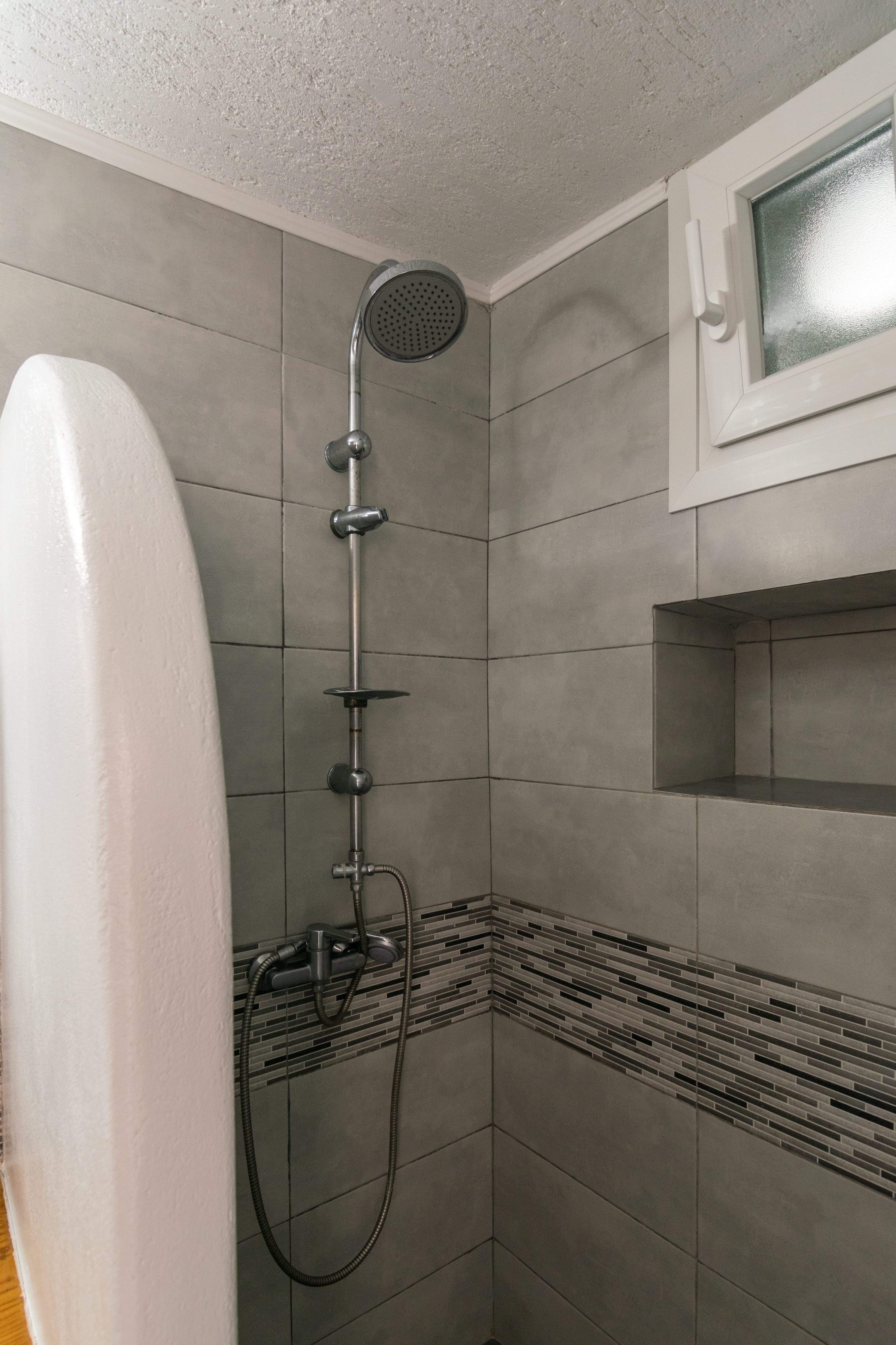 a shower with a stand up shower