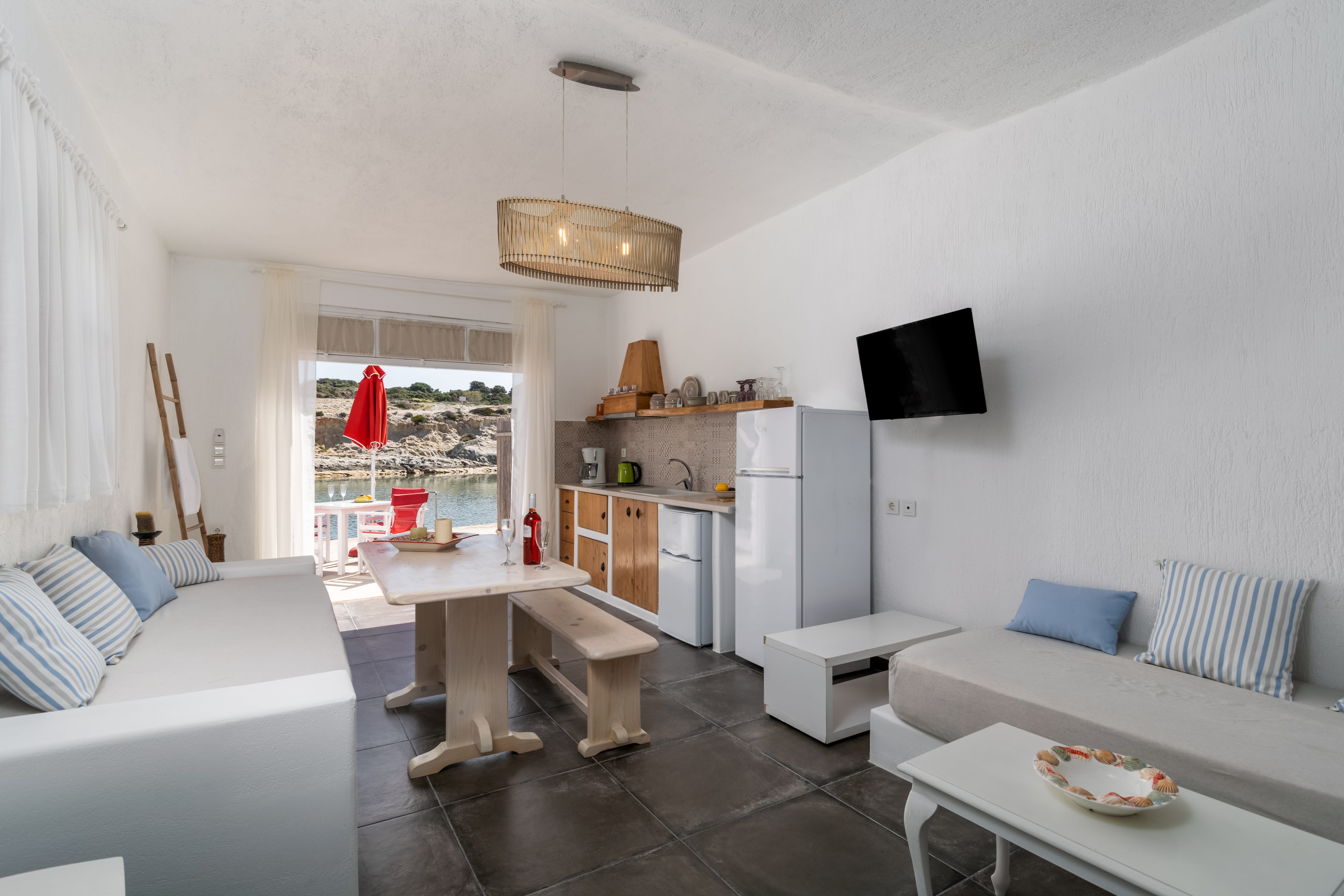 a living room with a tv and couches