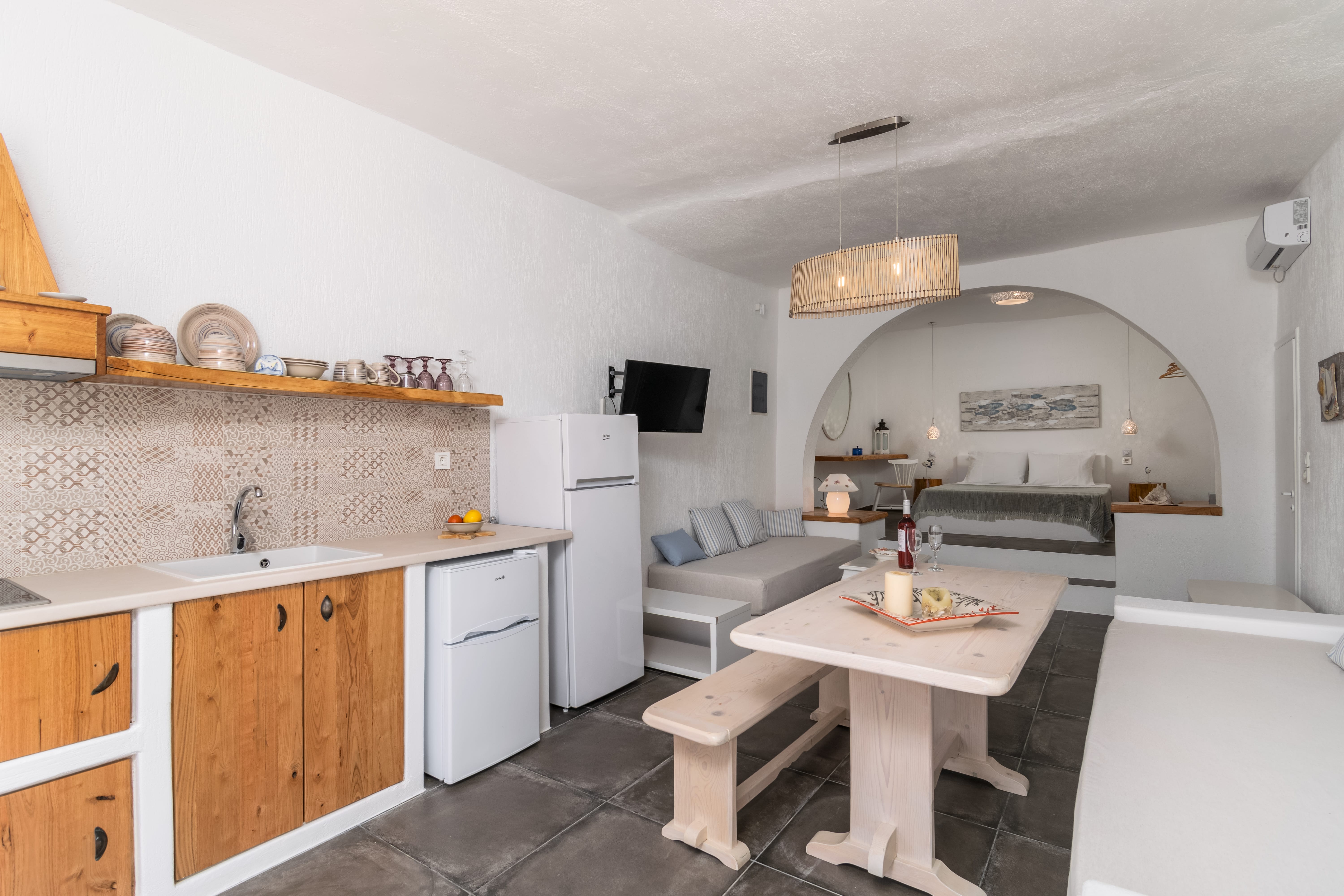 a kitchen with a table and chairs