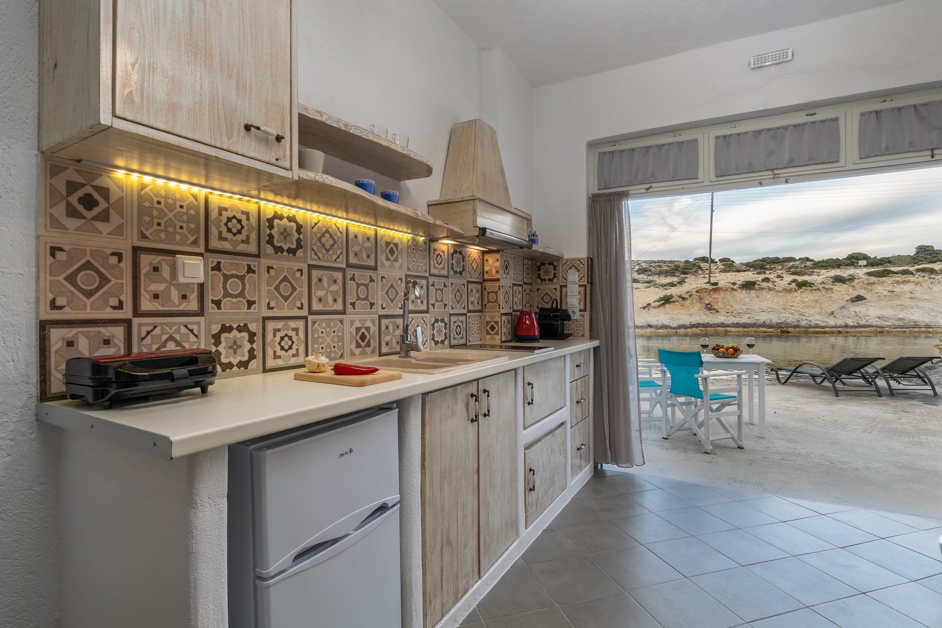 a kitchen with a tile floor