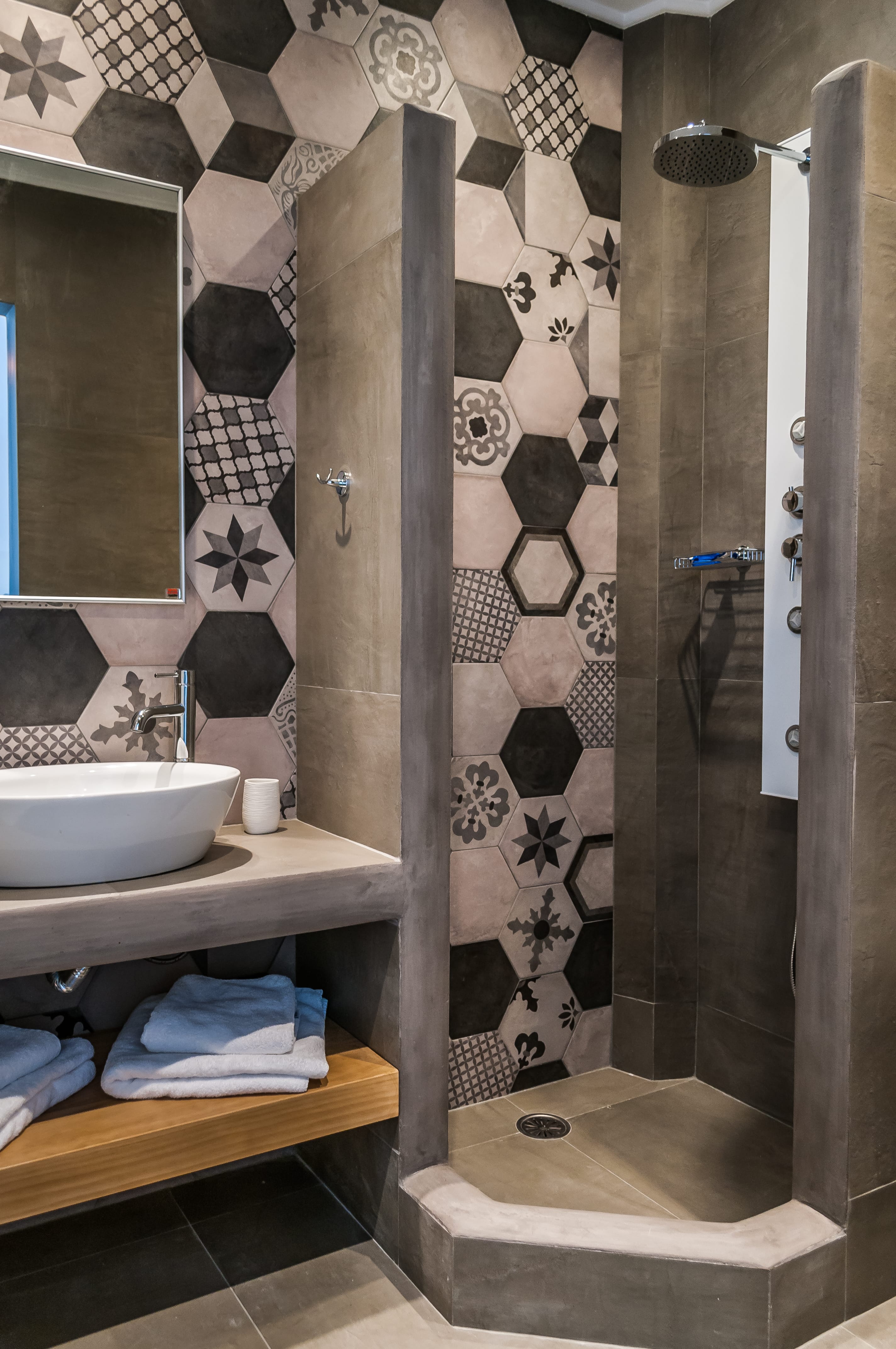 a bathroom with a sink and a shower unit
