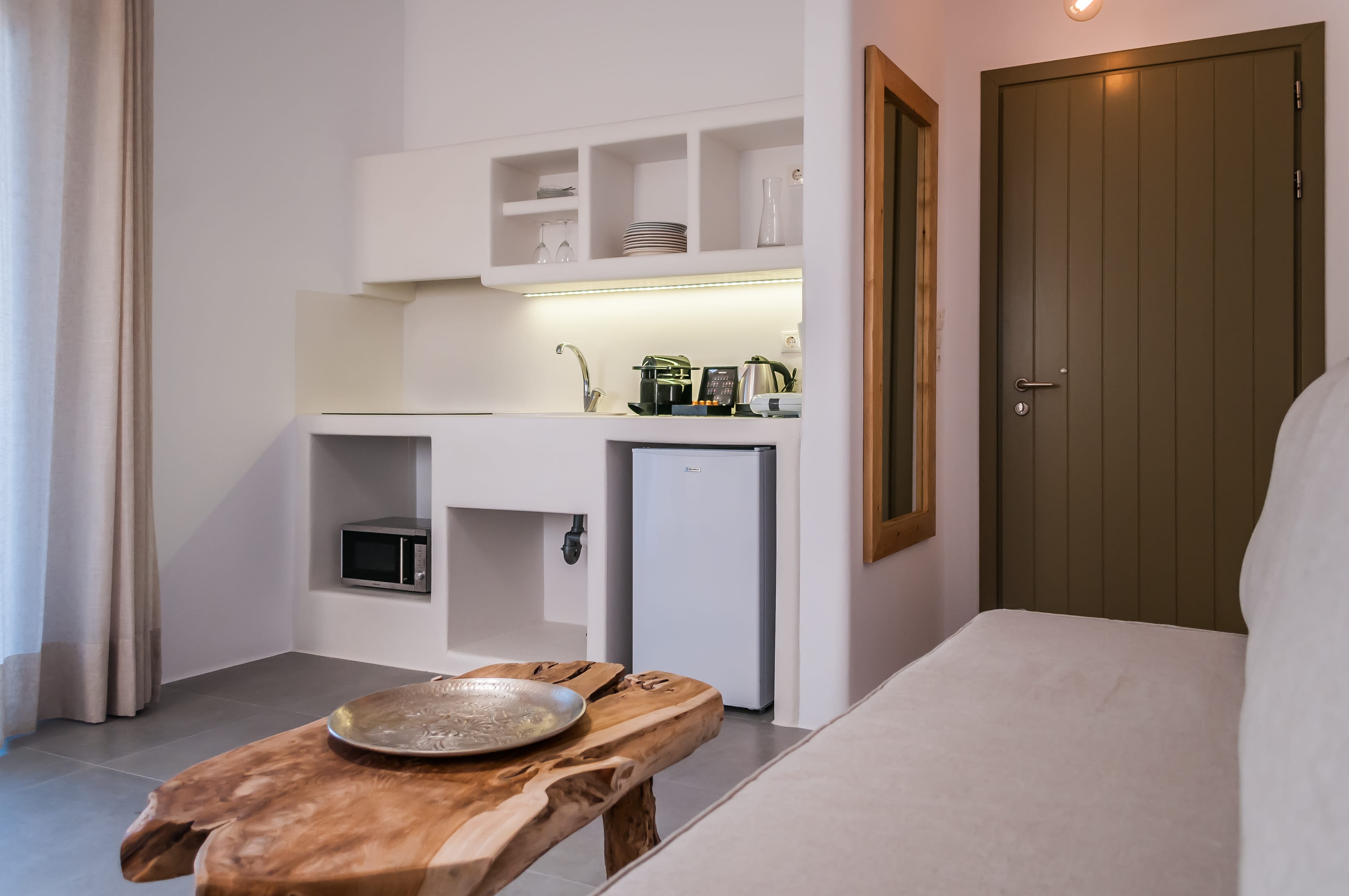 a kitchen with white cabinets