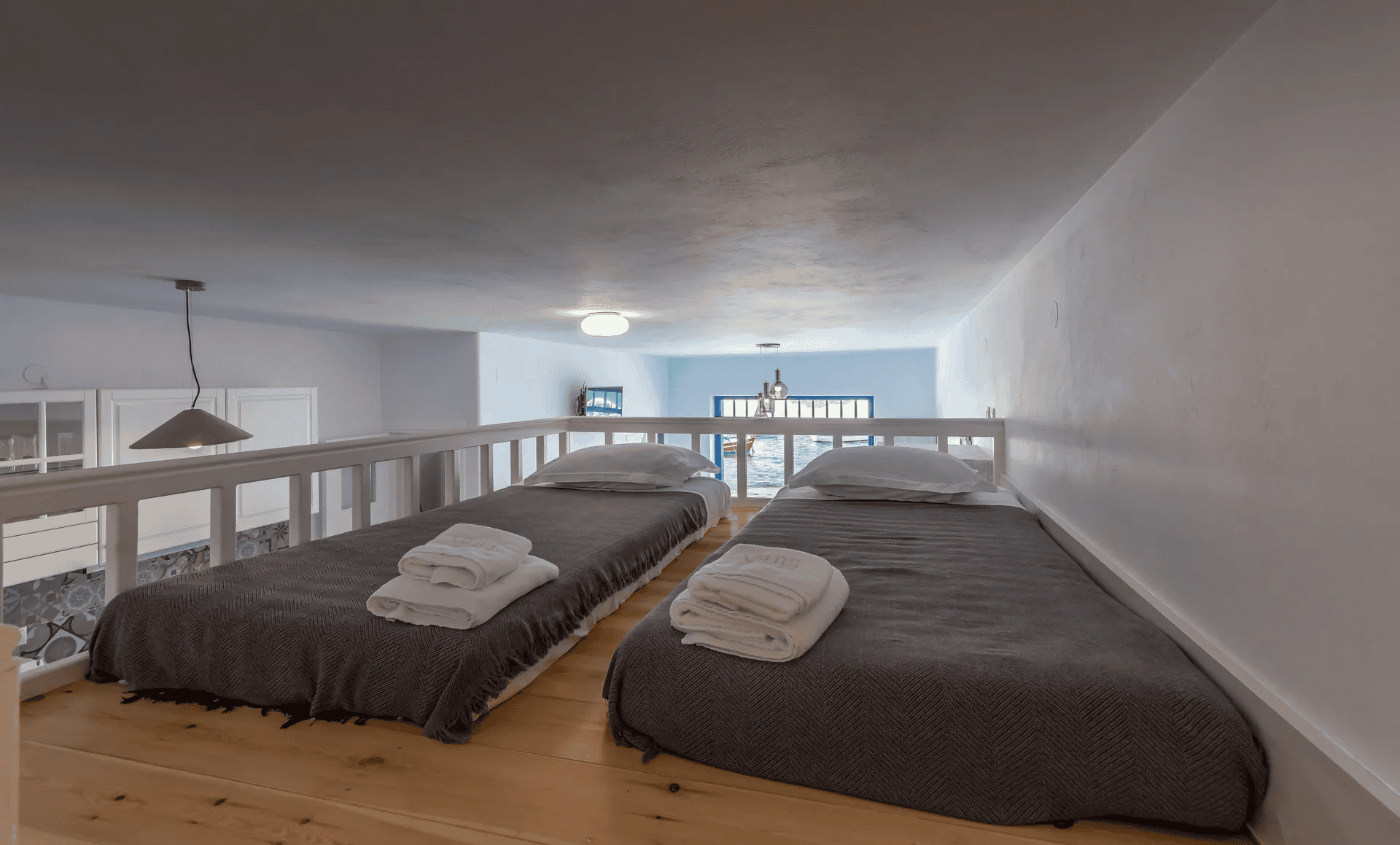 a couple of beds in a room