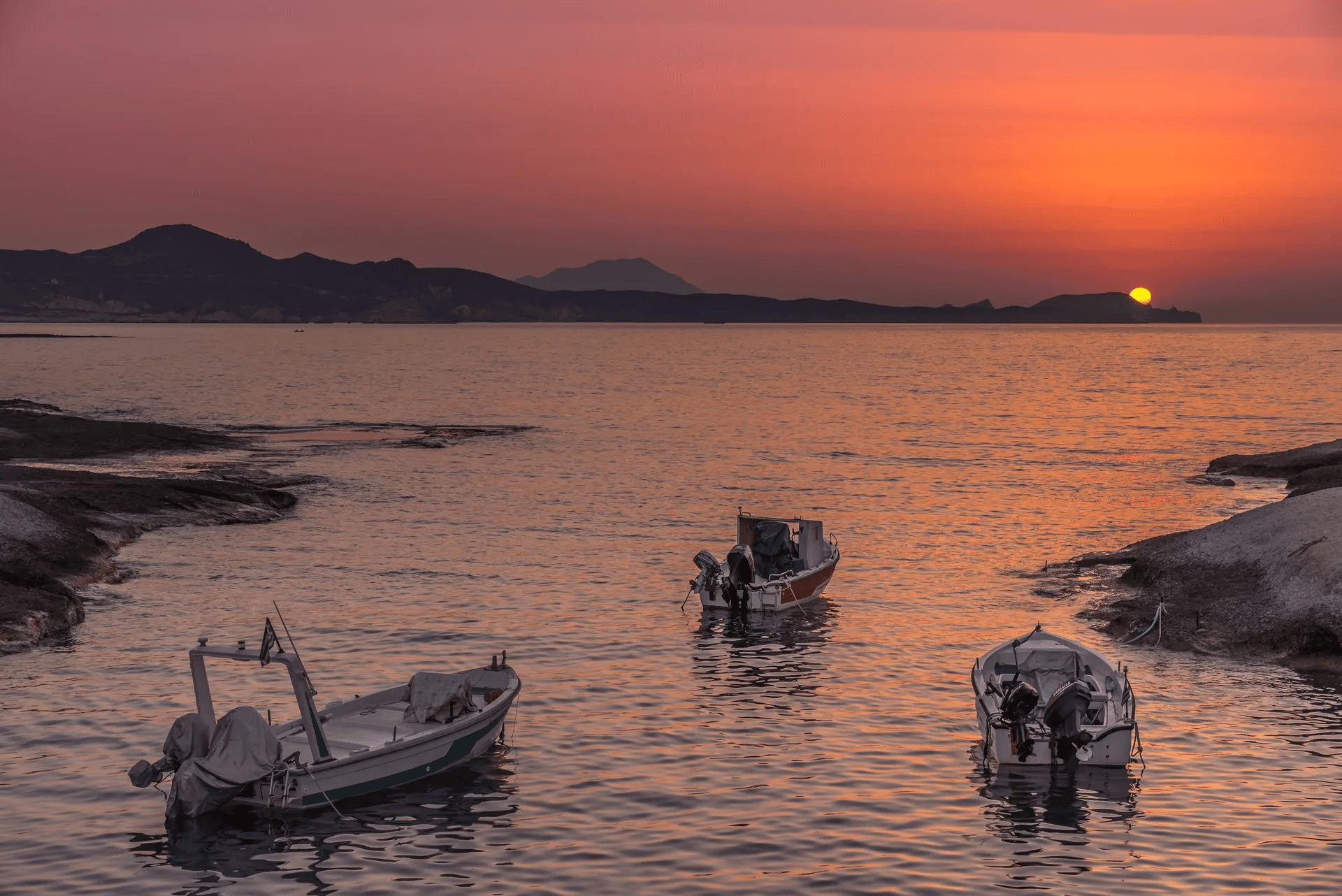 a group of boats sit in the water
