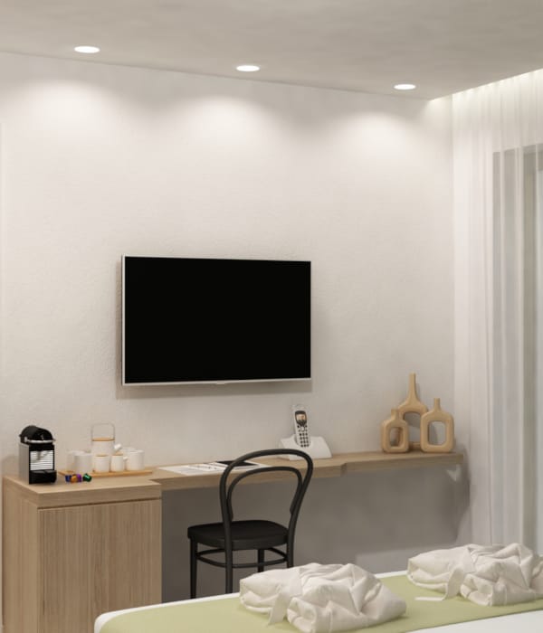 a room with a tv and a bed