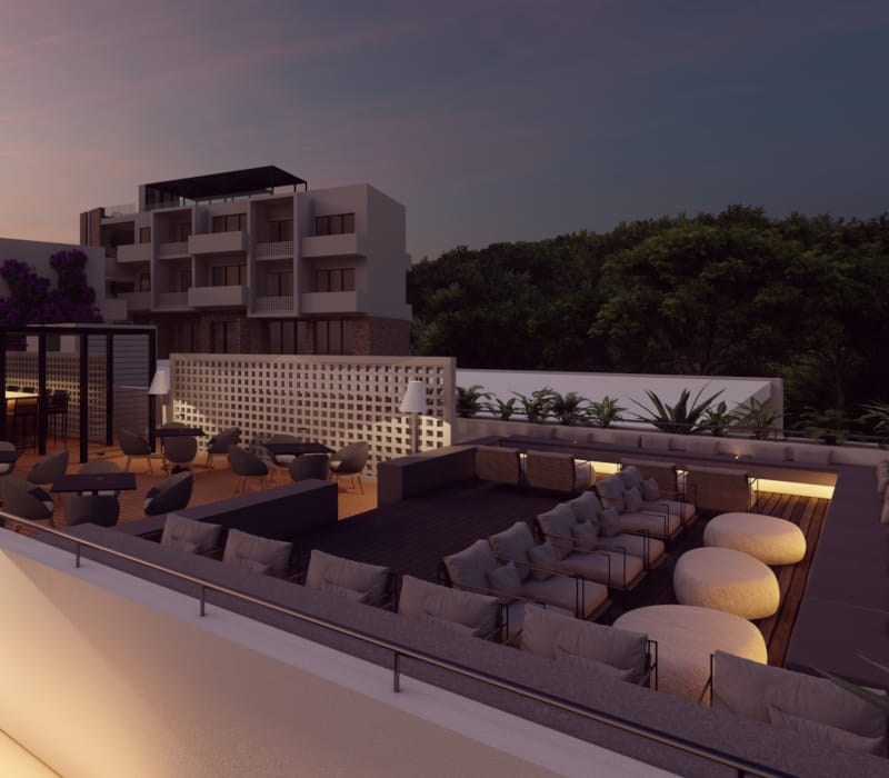 a building with a pool and chairs