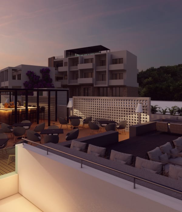 a building with a pool and chairs